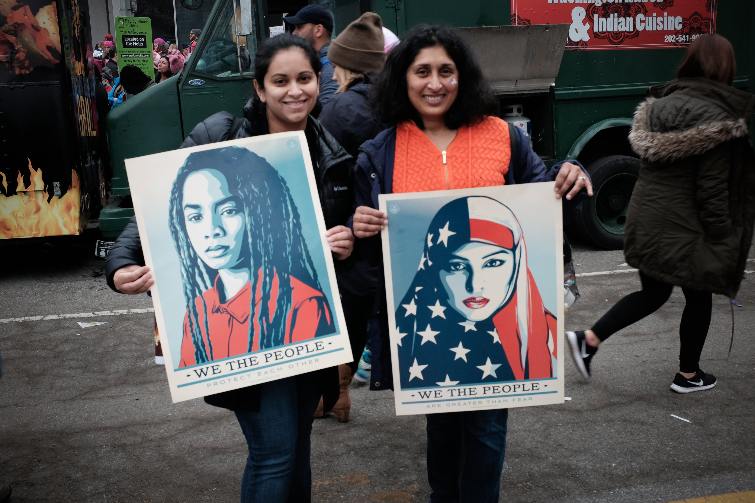 Left: "I'm here because I have two daughters. And I want to show them that even with all this diversity, we can still unite and fight for what we believe in". Right: "I'm proud to be here because we as south asians are one facet of this multi-faceted community, and I'm proud to represent one small part of this country" 
