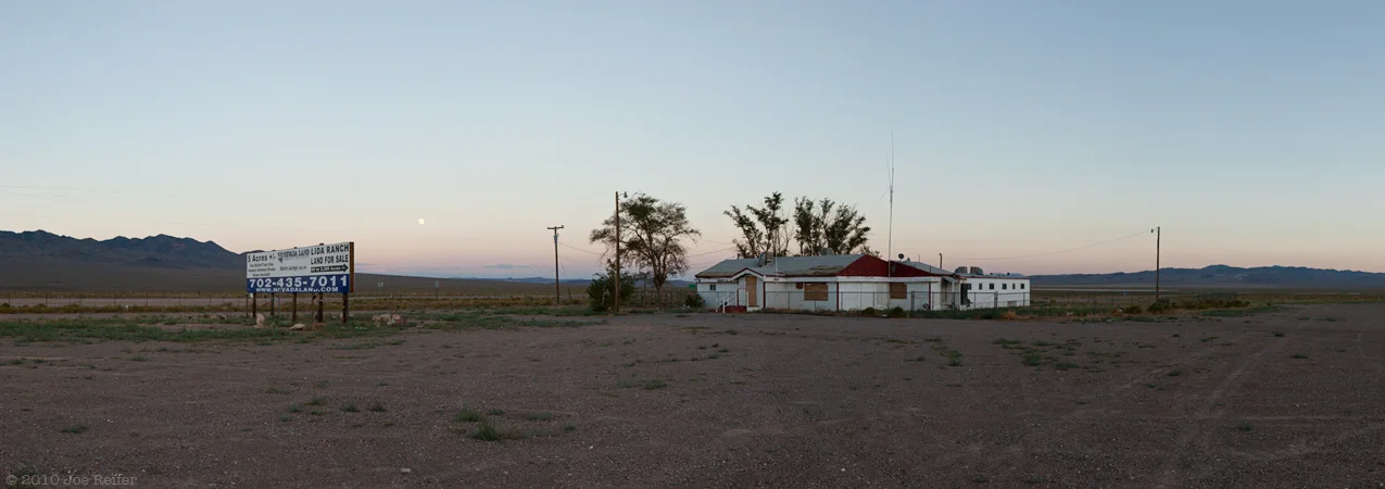 Sunset and moonrise over abandoned Nevada brothel -- by Joe Reifer