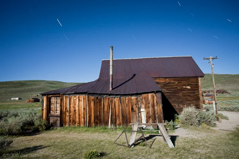 Bodie house with bicycle and sawhorse -- by Joe Reifer