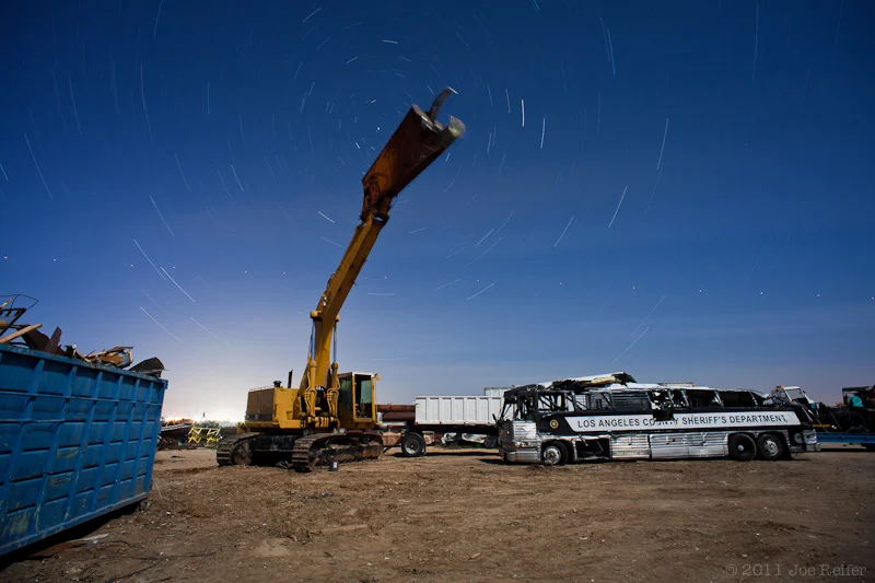 Dinosaur and crashed Sheriff's bus, Paul's Junkyard -- by Joe Reifer