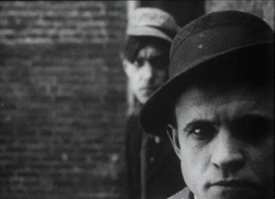 Elmer Booth in The Musketeers of Pig Alley , 1912