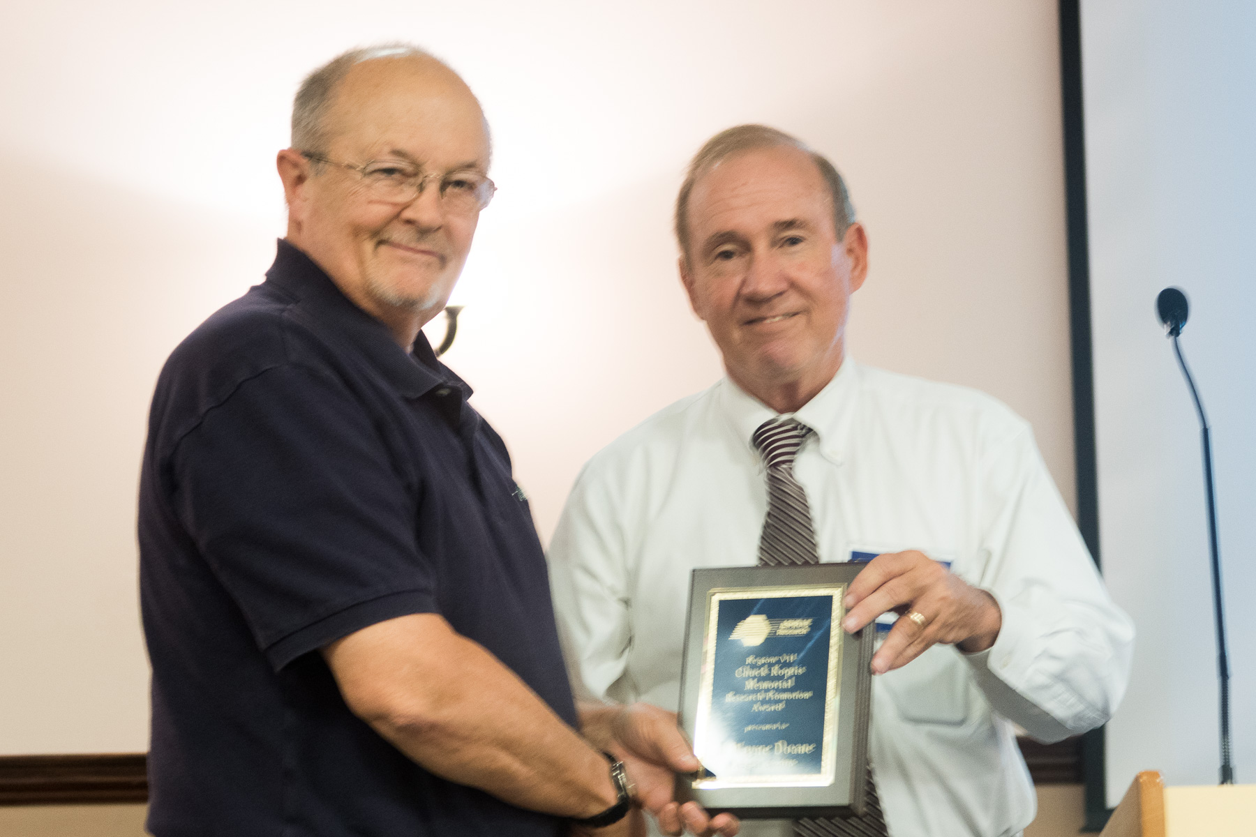  Wayne Doane, accepting the Chuck Koptis Award from outgoing RVC for Research, John Sealy 