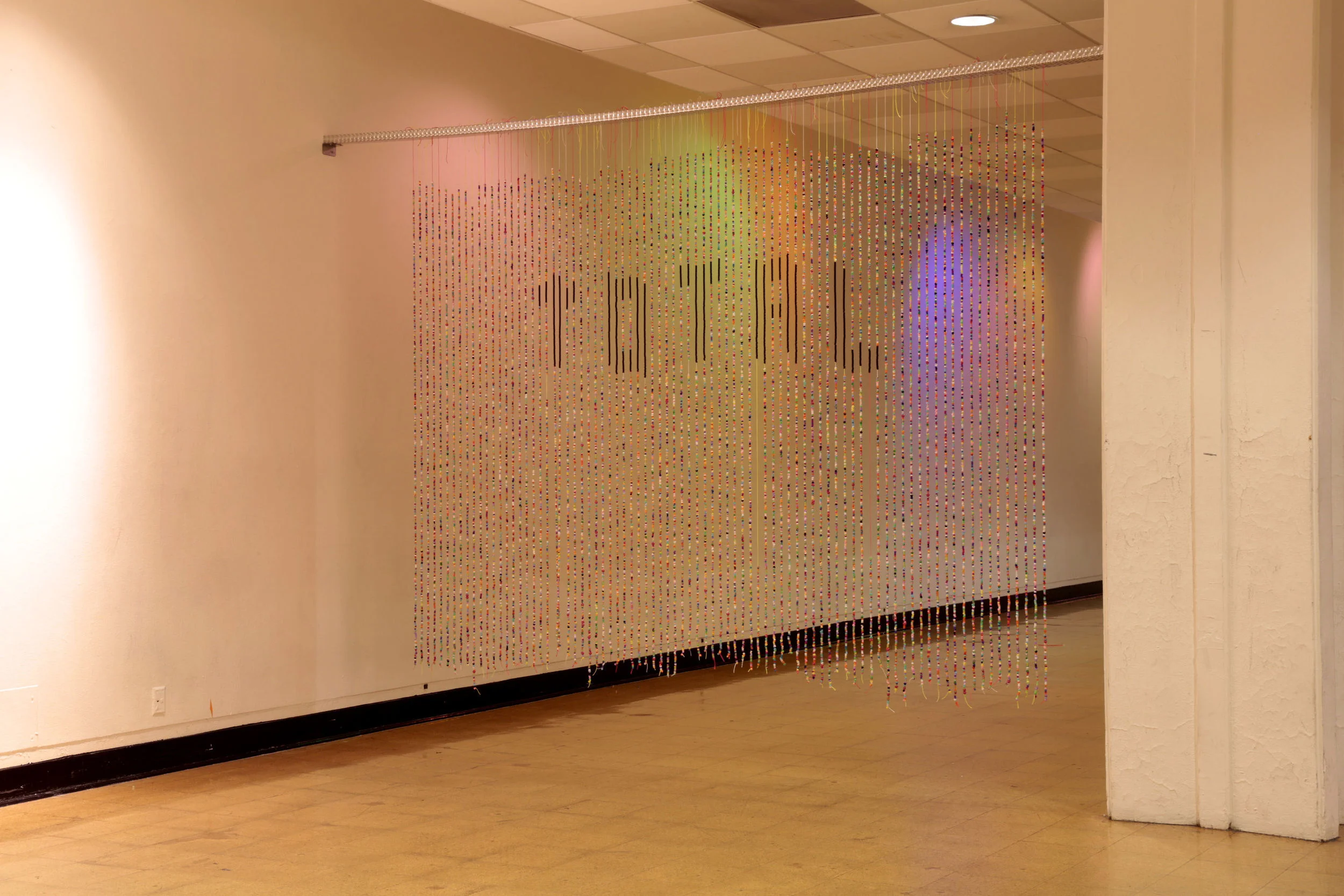 Total Collapse (2013) rave beads and twine, 14 x 8 ft