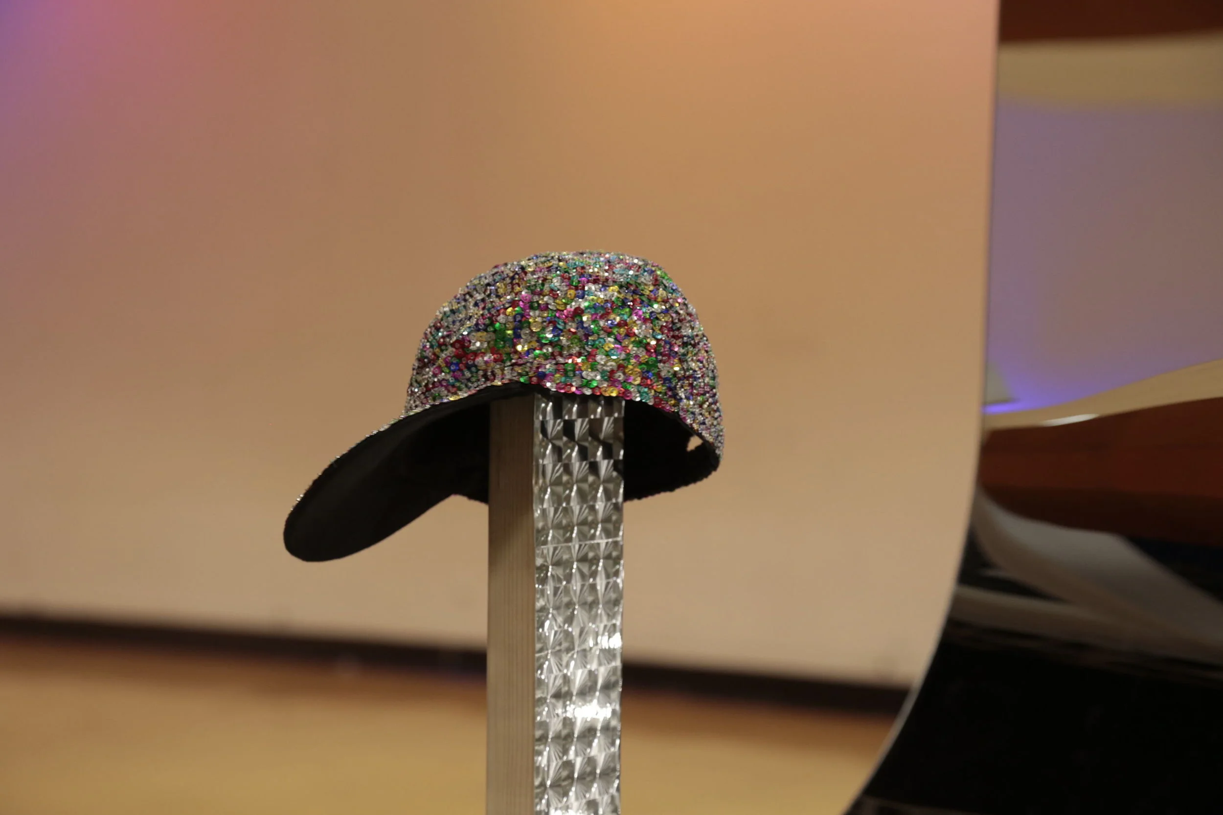 Untitled (Womp Womp Womp Womp) (detail) (2013) Acrylic mirror, pine, holographic vinyl and sequin cap on rotating display stand 4 x 4 x 8 ft