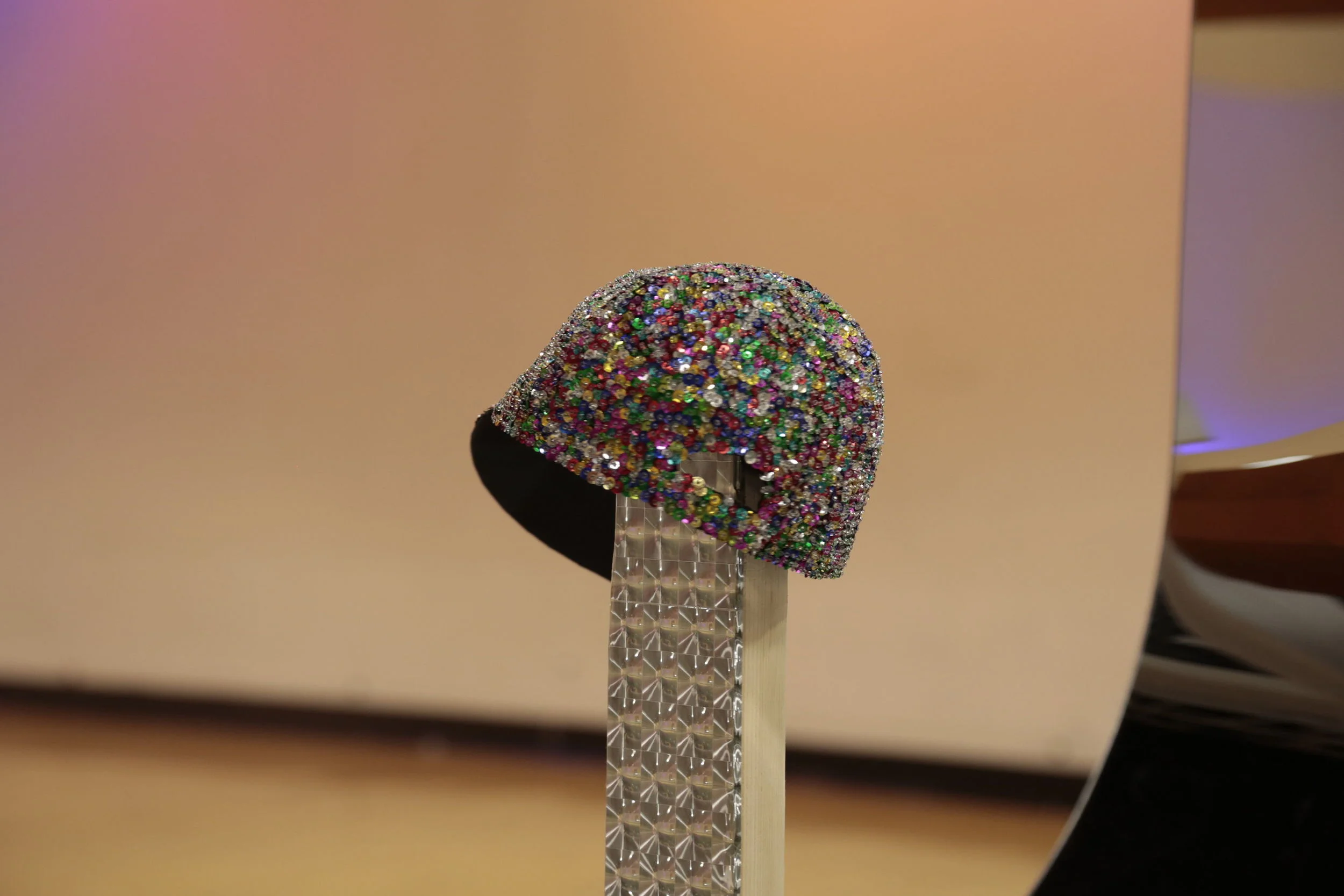 Untitled (Womp Womp Womp Womp) (detail) (2013) Acrylic mirror, pine, holographic vinyl and sequin cap on rotating display stand 4 x 4 x 8 ft