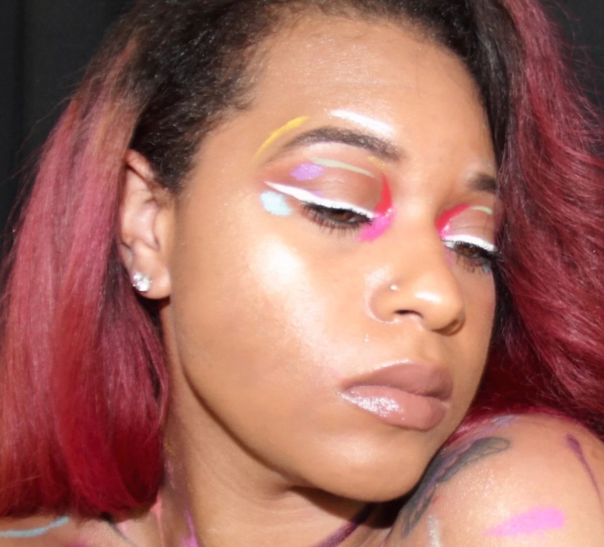 Wears black, but her mind is colorful