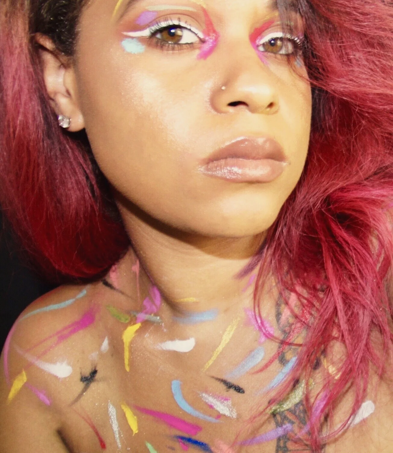 Wears black, but her mind is colorful