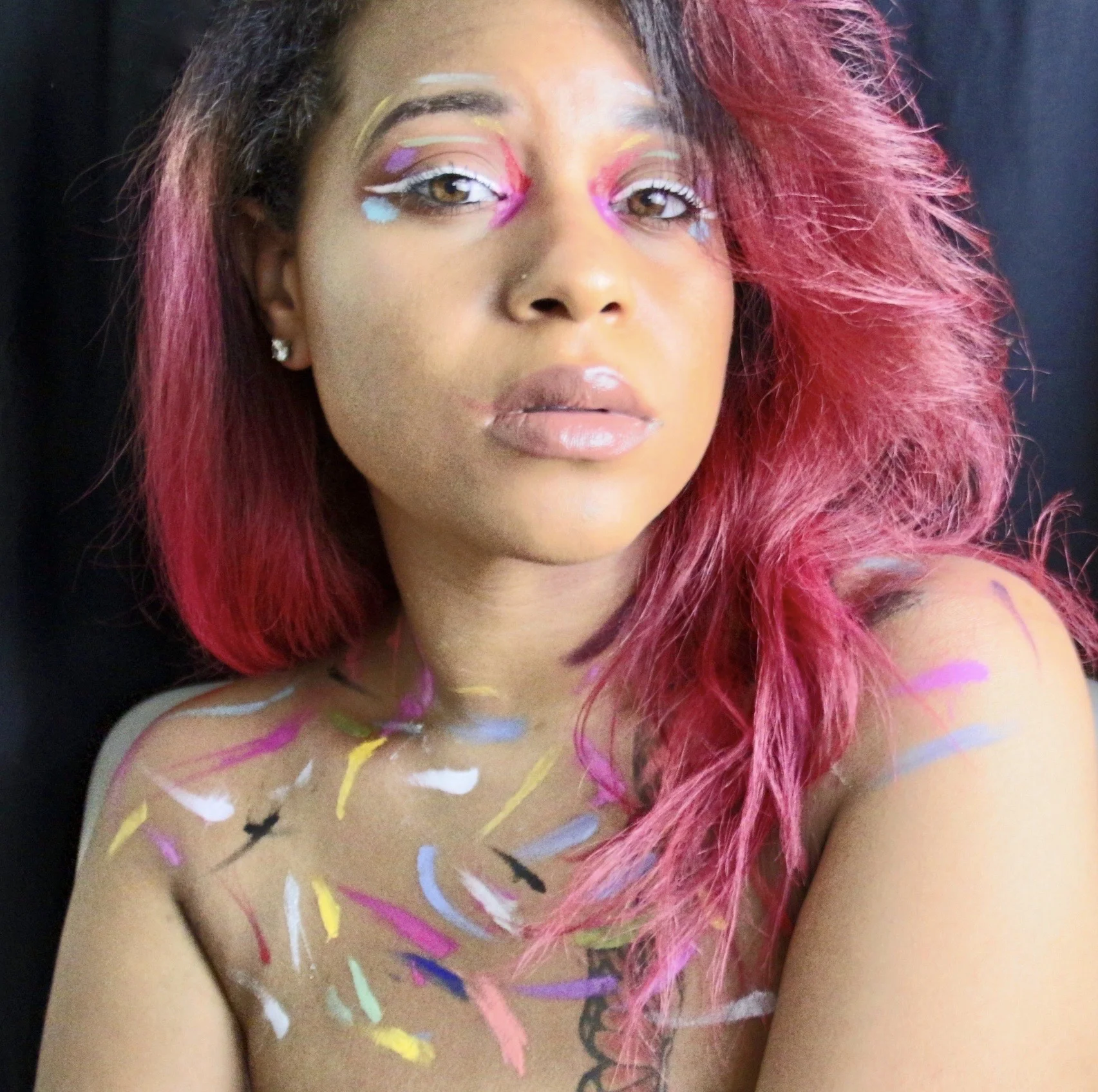 Wears black, but her mind is colorful