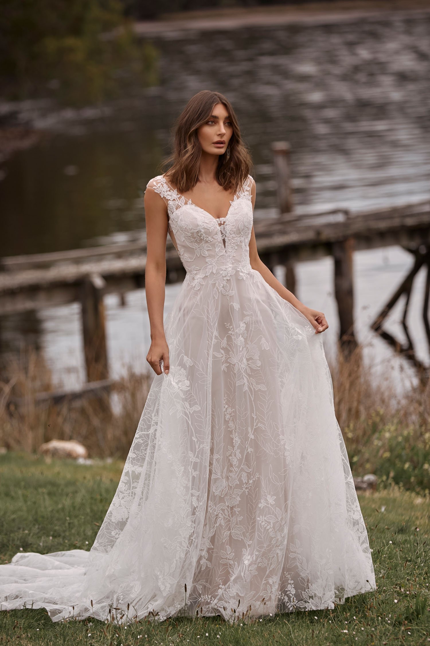 CAMILLE ML20022 FULL LENGTH A LINE FLORAL LACE GOWN WITH WIDE ILLUSION STRAPS AND HIGH ILLUSION BACK WITH BUTTONS ZIPPER SKIRT WEDDING DRESS MADI LANE BRIDAL 1.jpg