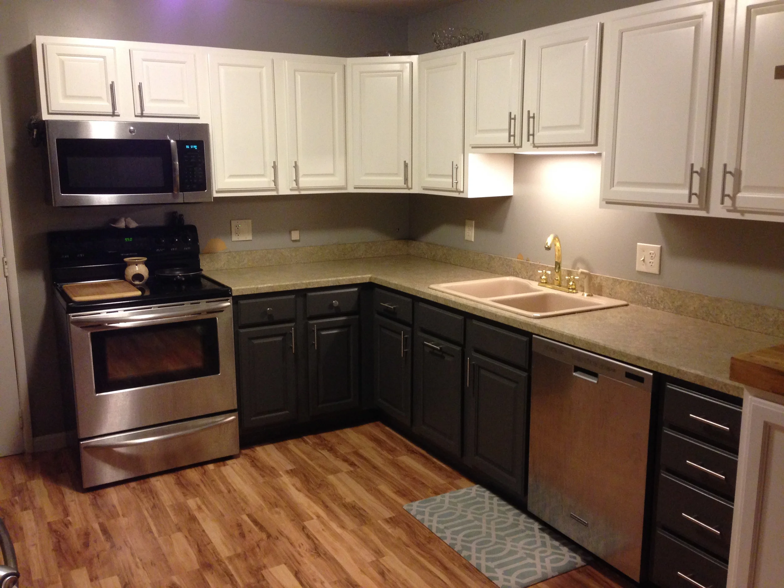 PROGRESS - New floors, freshly painted cabinets, new hardware, new microwave hood and dishwasher