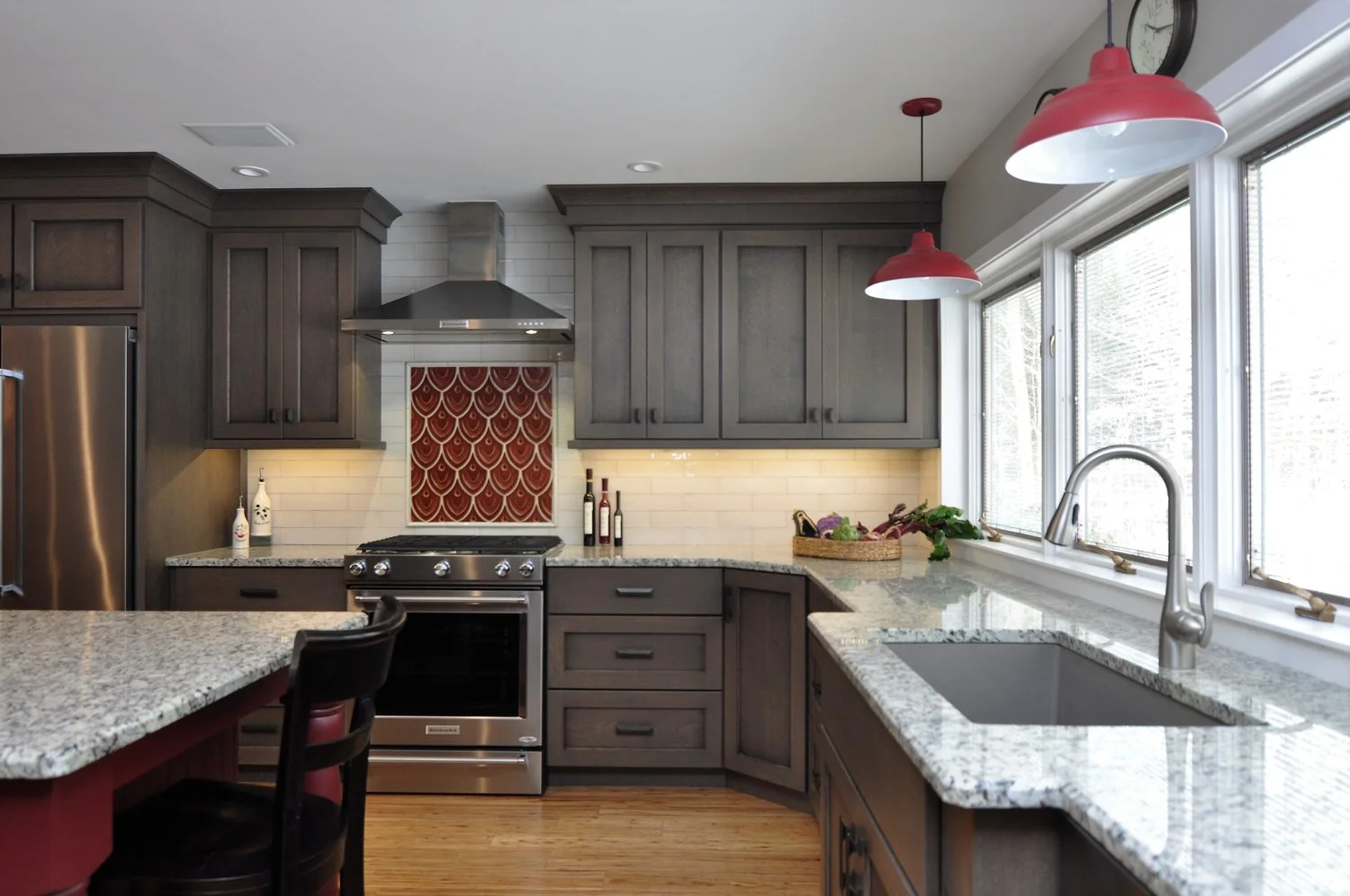 Designed by Erica Smith CMKBD, CAPS / Plato Woodwork (and Prelude) Cabinetry, Full Overlay Anthem Door Style, Quartersawn Oak with Coast Grey Stain with a Black Glaze (Island in Cottage Red Paint with Black Glaze) / Moon Light Granite Counter Tops