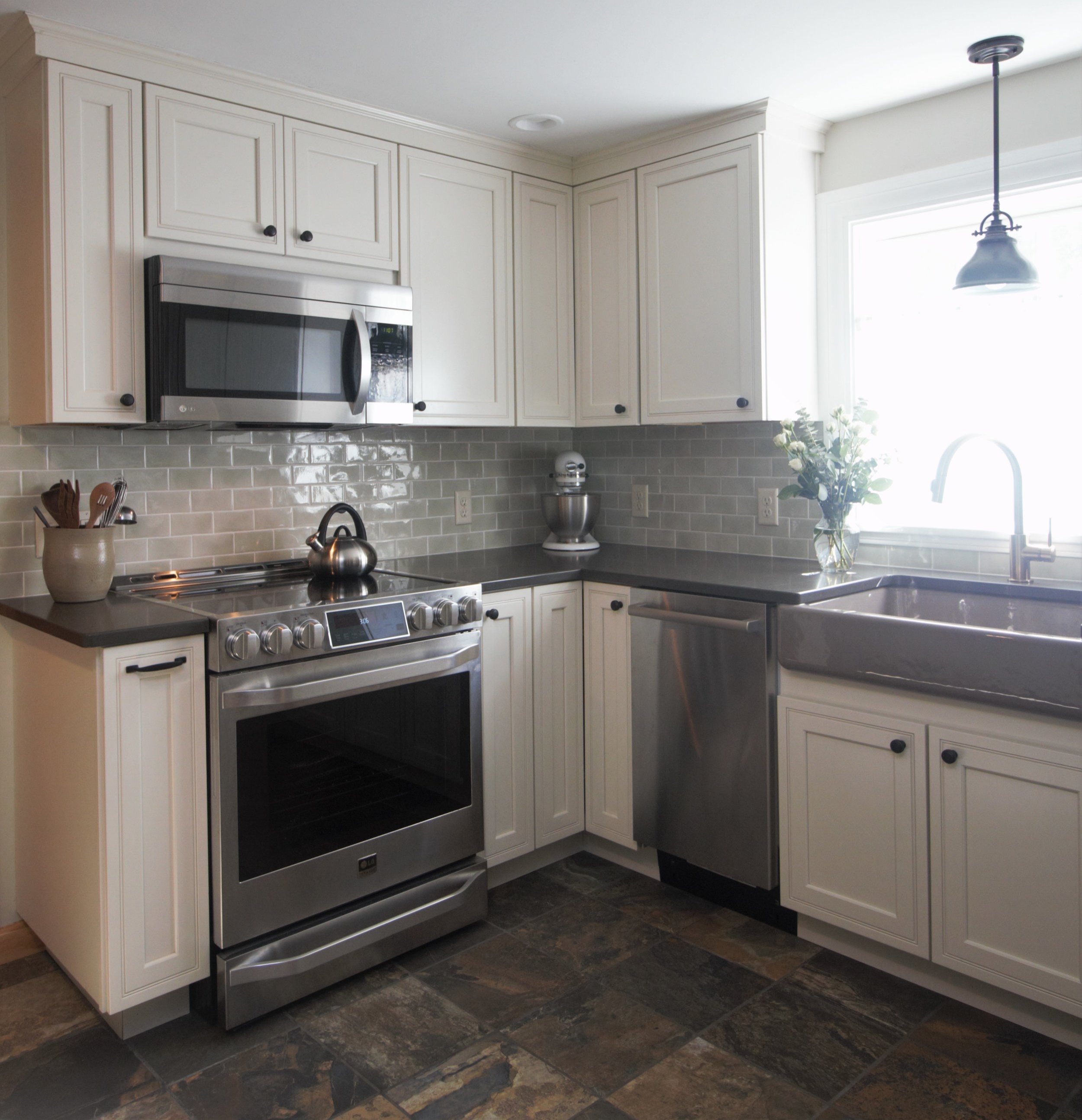 Designed by Solana James CKD / Kraftmaid Cabinets, Full Overlay Argonne Door Style, Maple Wood with Canvas Painted Finish / Caesarstone Pietra Grey Quartz Counter Tops