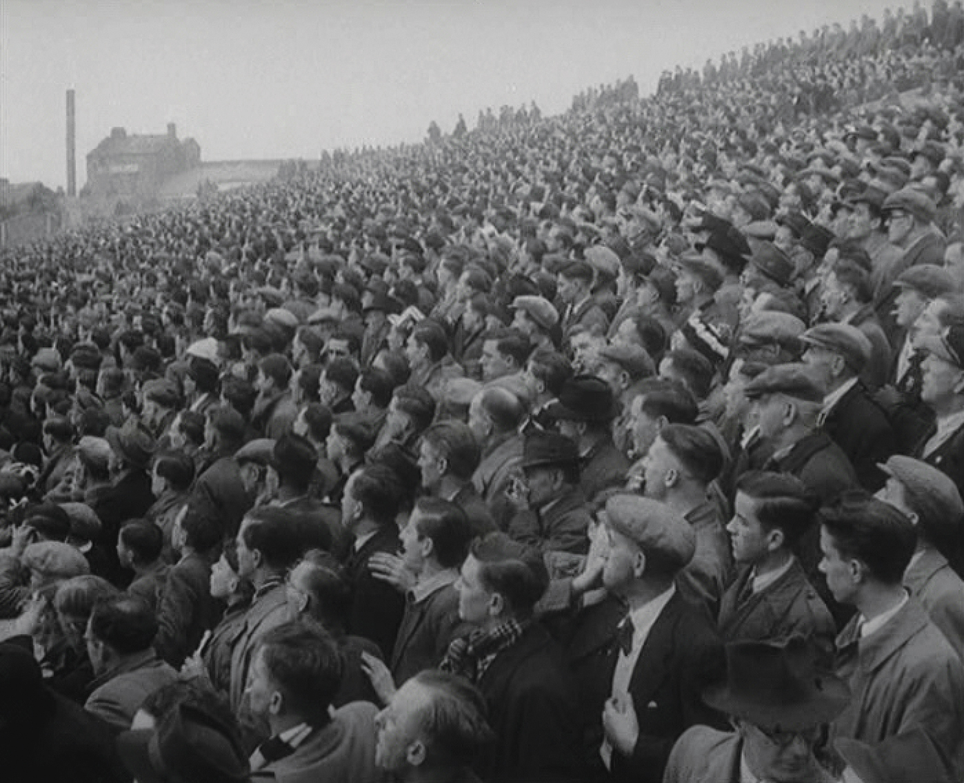 Suited fans watch Swansea vs NorthBank - circa 1950s 