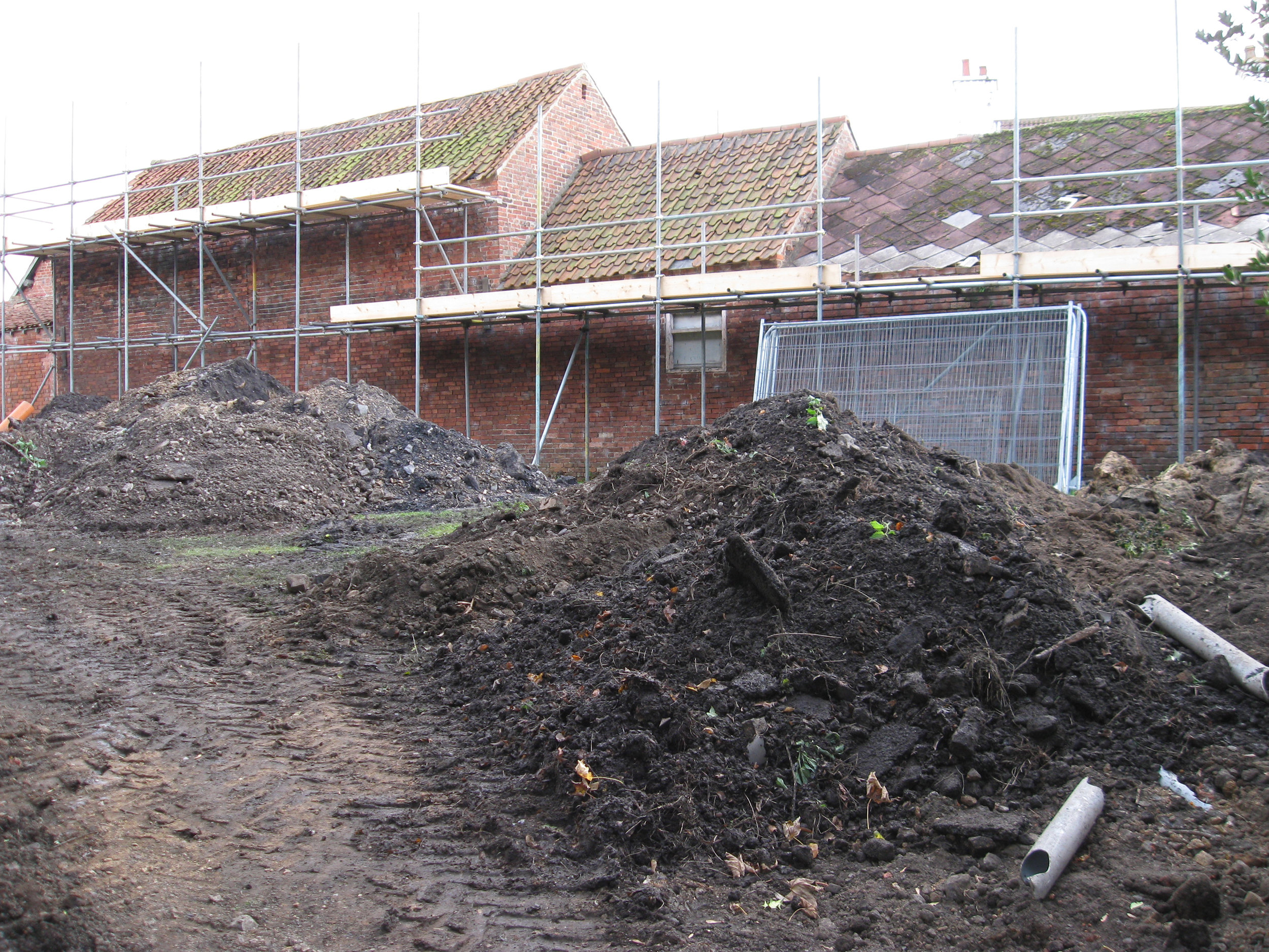  Soil scraped from the lane piling up 