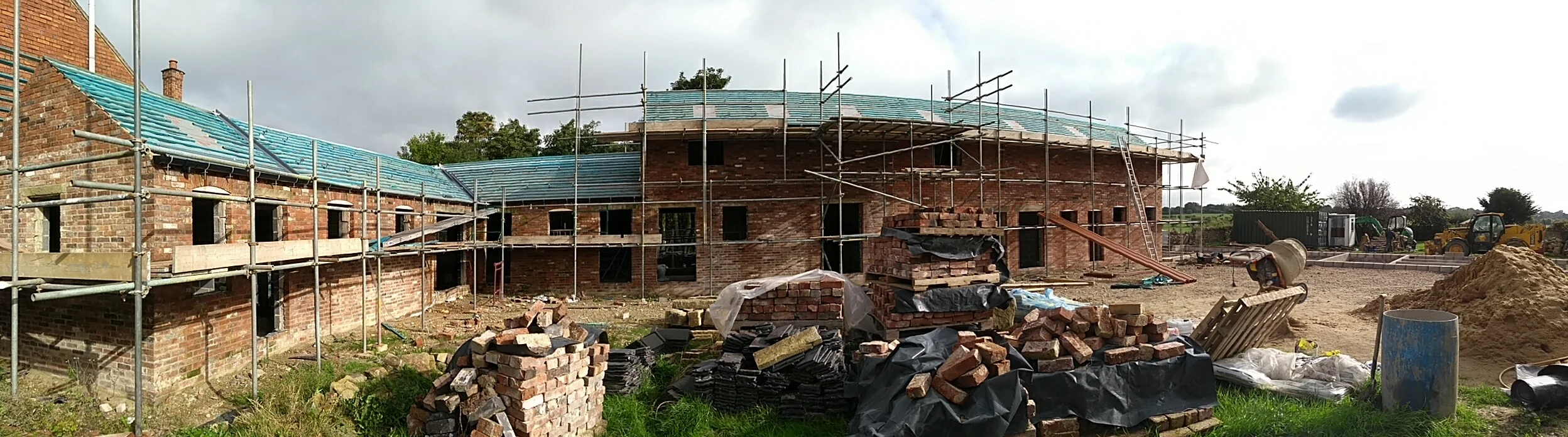 Panorama of barn 1 and 2. You can just see the footings for barn 3