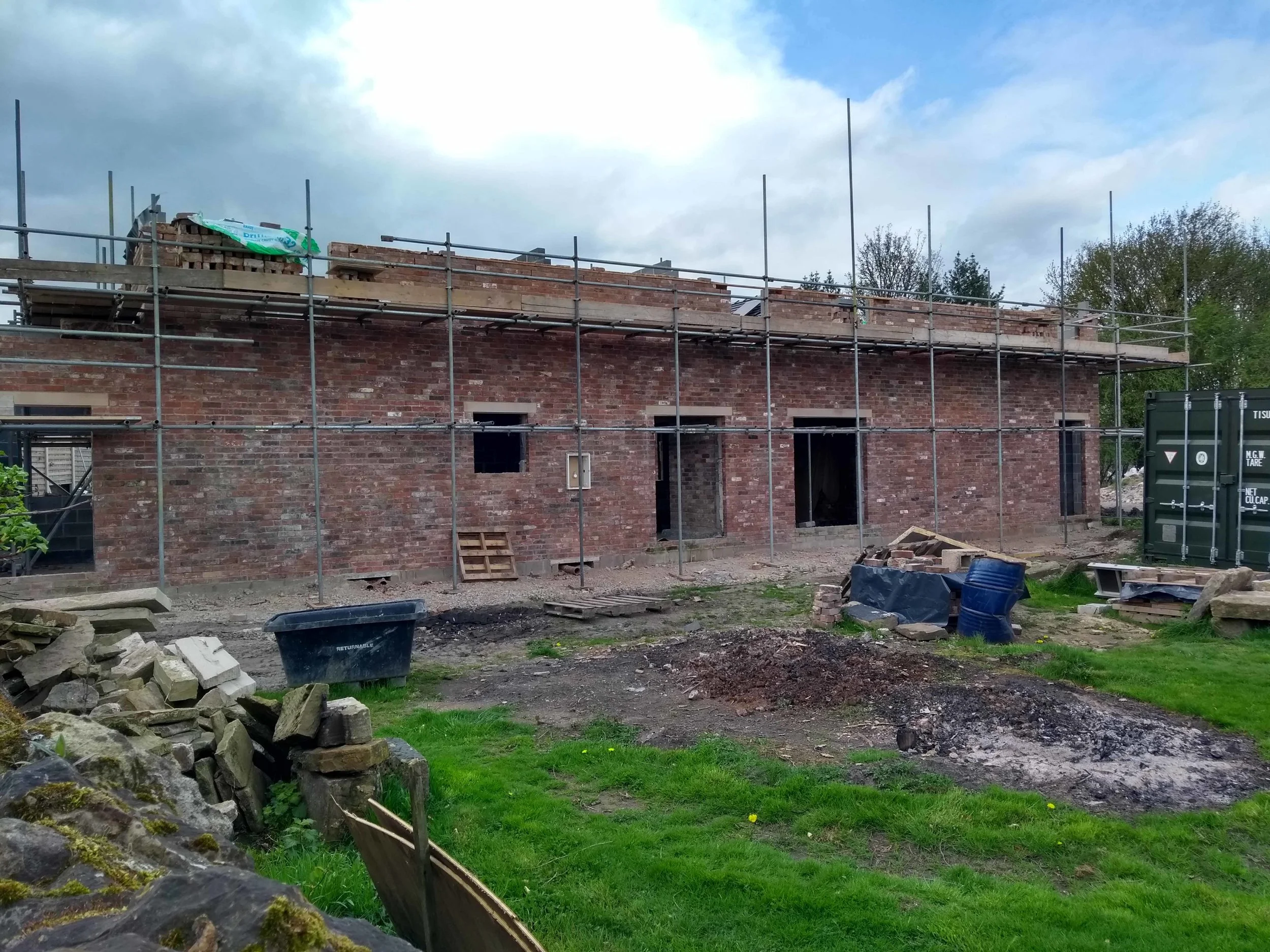 The scaffolding is getting higher and so is the brickwork.