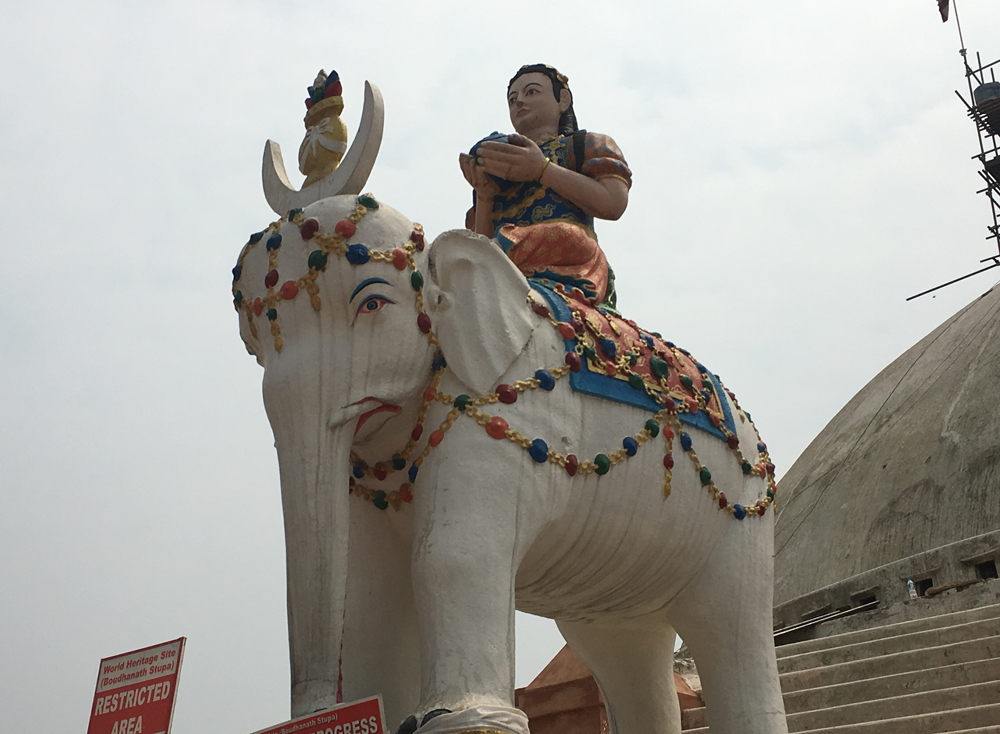 Elephant statue guarding the stupa