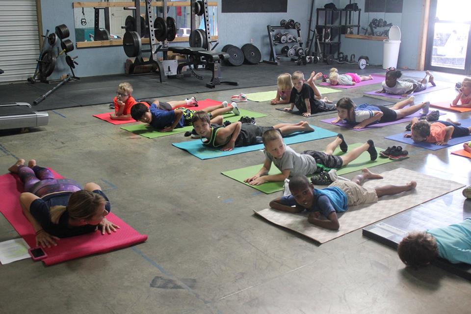 Cobra pose, kind of. Photo credit: Climb Upstate
