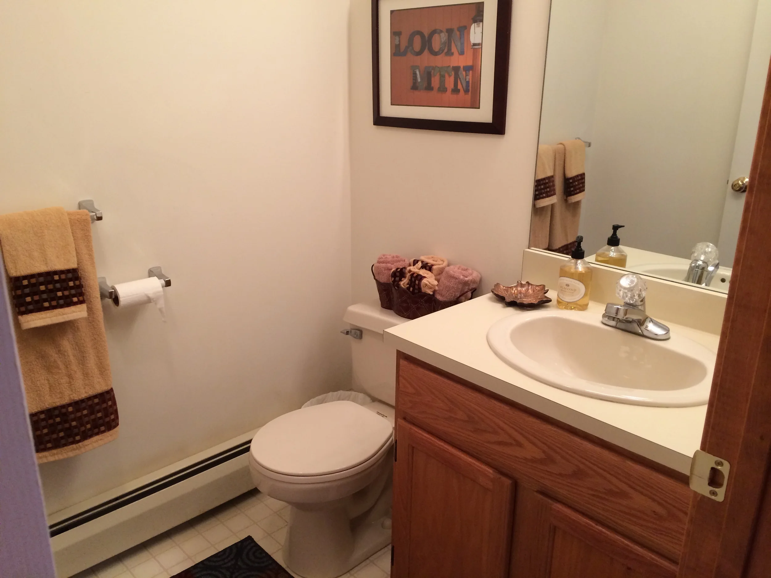 Convenient 1/2 bath powder room off main living area