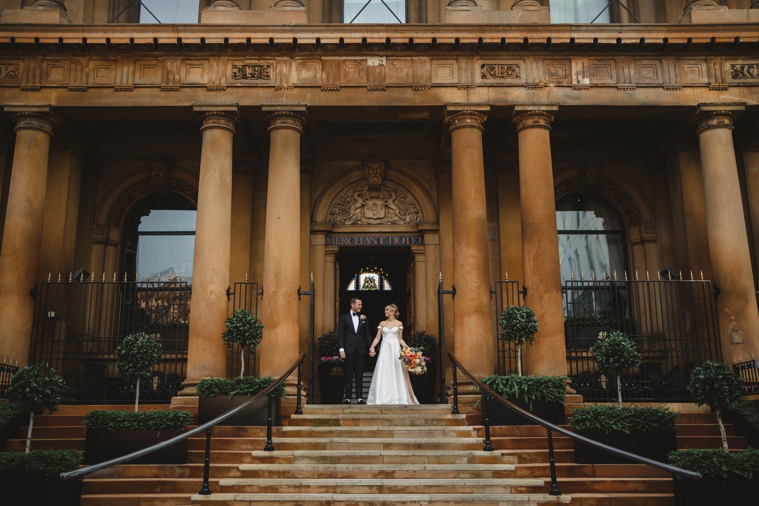  Jack McGarry and Katie Marino’s Wedding in Larchfield, Lisburn with Photographs in Belfast’s Cathedral Quarter, The Duke of York and the Merchant Hotel. Katie wore a gorgeous dress by Karen Willis Holmes, while Jack dressed in a black tie. Flowers w