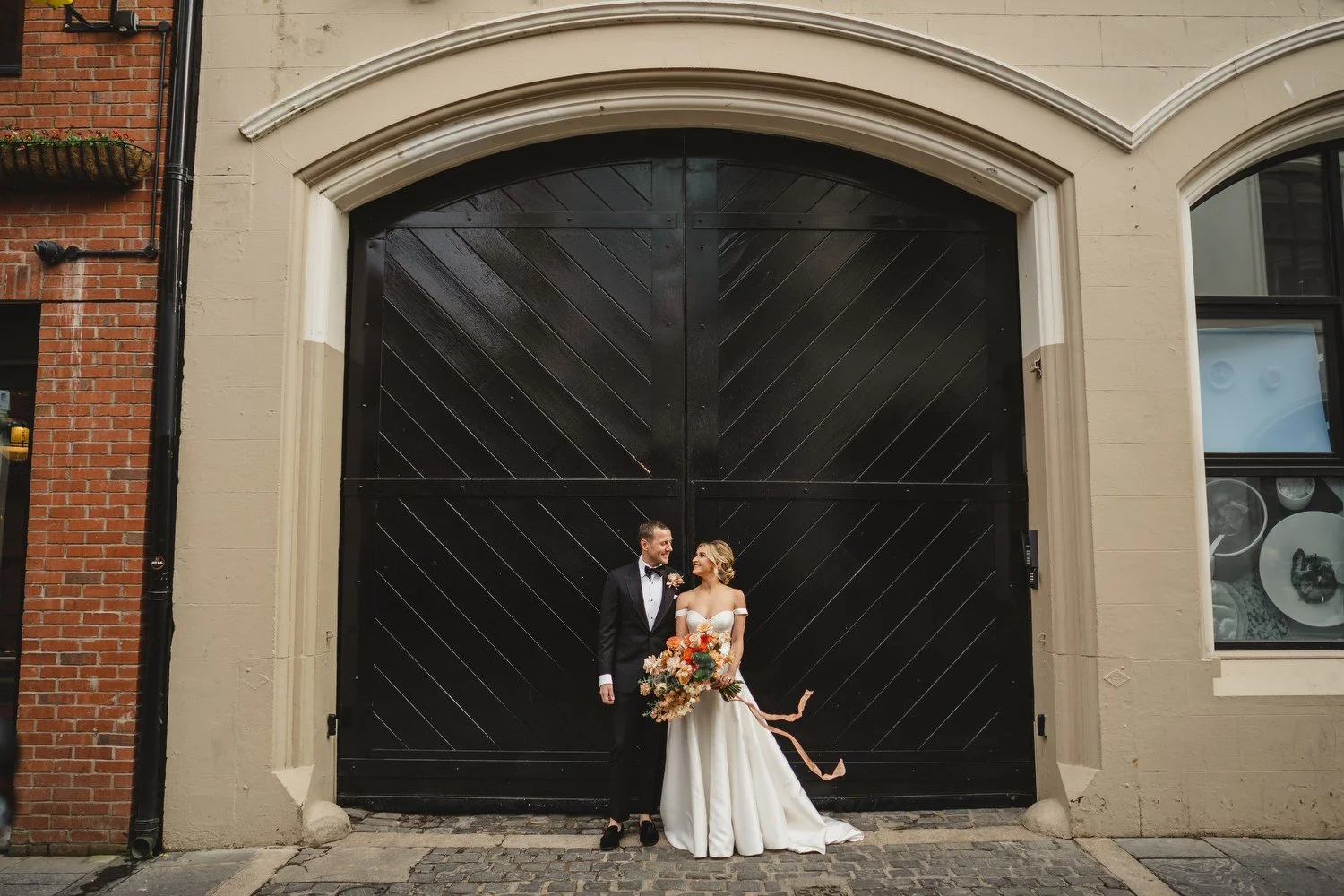  Jack McGarry and Katie Marino’s Wedding in Larchfield, Lisburn with Photographs in Belfast’s Cathedral Quarter, The Duke of York and the Merchant Hotel. Katie wore a gorgeous dress by Karen Willis Holmes, while Jack dressed in a black tie. Flowers w