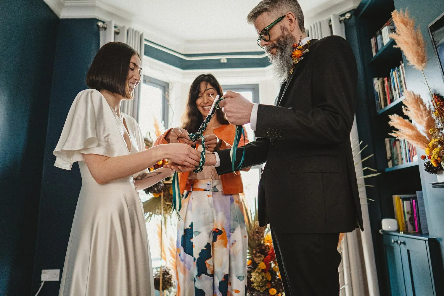  Kathryn and ChrisÕs wedding was supposed to be in Babel rooftop but it burned down 4 days before they were due to get married.  Instead they had their humanist wedding in their own house followed by photos in nearby Ormeau Park and Belfast Cathedral