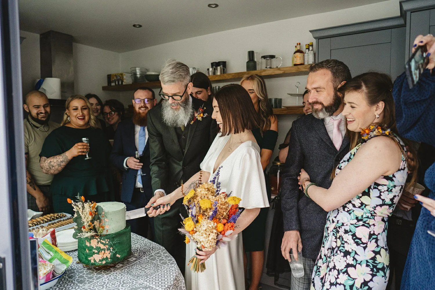  Kathryn and ChrisÕs wedding was supposed to be in Babel rooftop but it burned down 4 days before they were due to get married.  Instead they had their humanist wedding in their own house followed by photos in nearby Ormeau Park and Belfast Cathedral