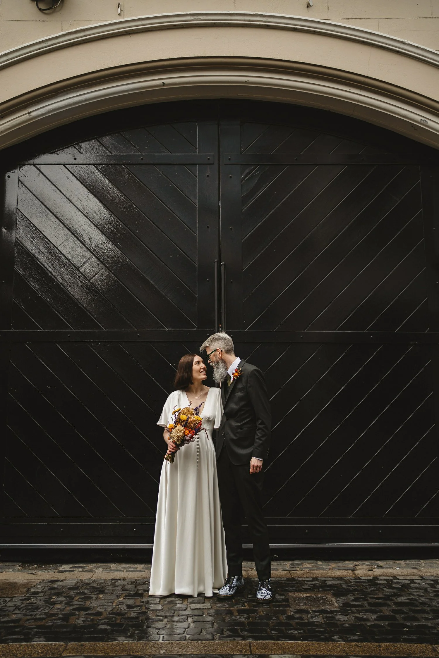  Kathryn and ChrisÕs wedding was supposed to be in Babel rooftop but it burned down 4 days before they were due to get married.  Instead they had their humanist wedding in their own house followed by photos in nearby Ormeau Park and Belfast Cathedral