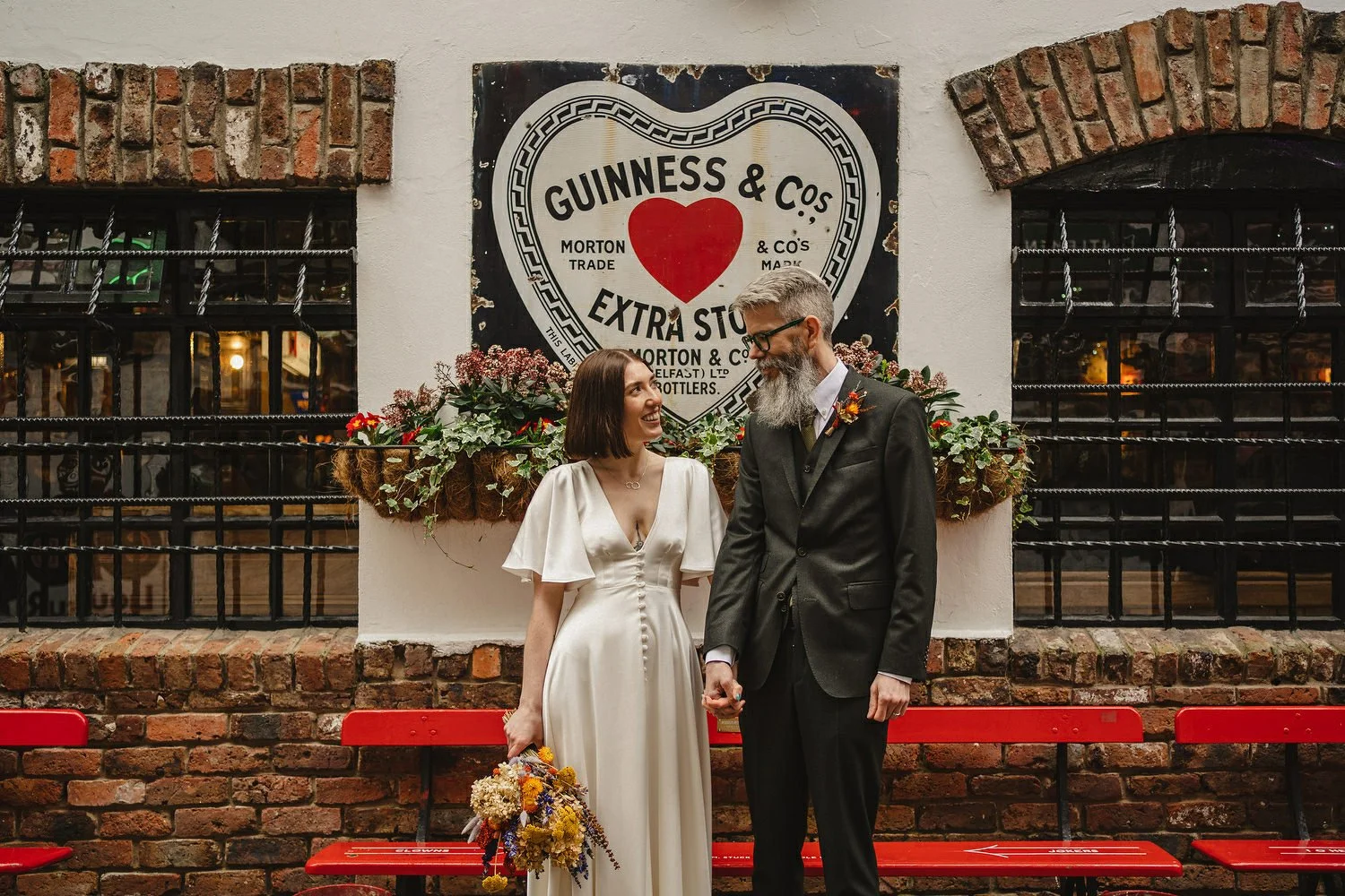  Kathryn and ChrisÕs wedding was supposed to be in Babel rooftop but it burned down 4 days before they were due to get married.  Instead they had their humanist wedding in their own house followed by photos in nearby Ormeau Park and Belfast Cathedral