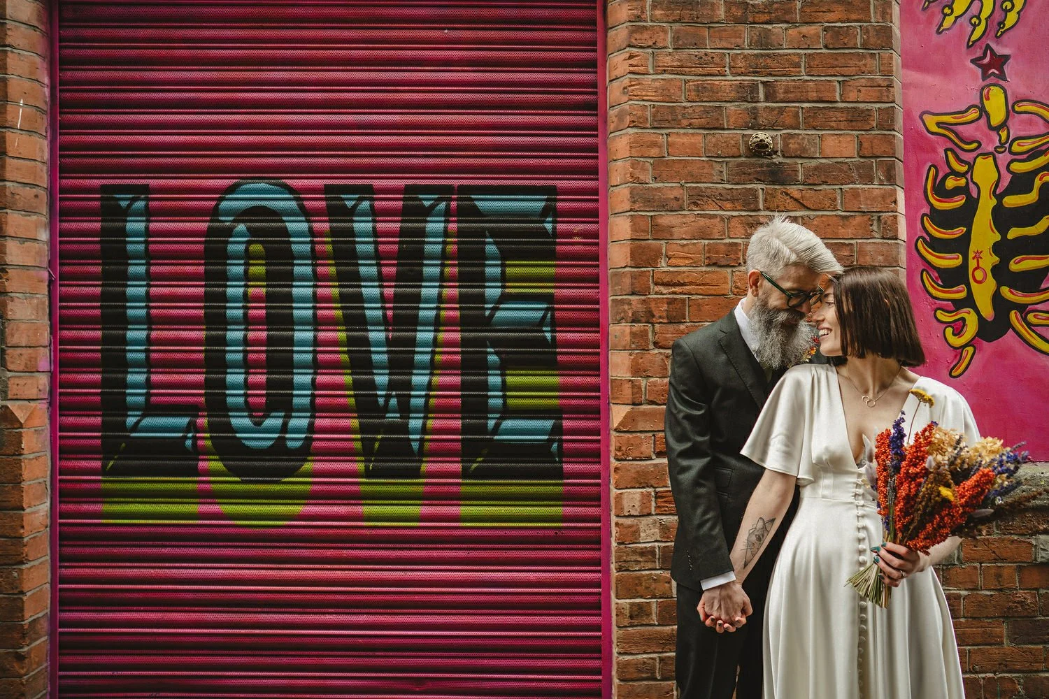  Kathryn and ChrisÕs wedding was supposed to be in Babel rooftop but it burned down 4 days before they were due to get married.  Instead they had their humanist wedding in their own house followed by photos in nearby Ormeau Park and Belfast Cathedral