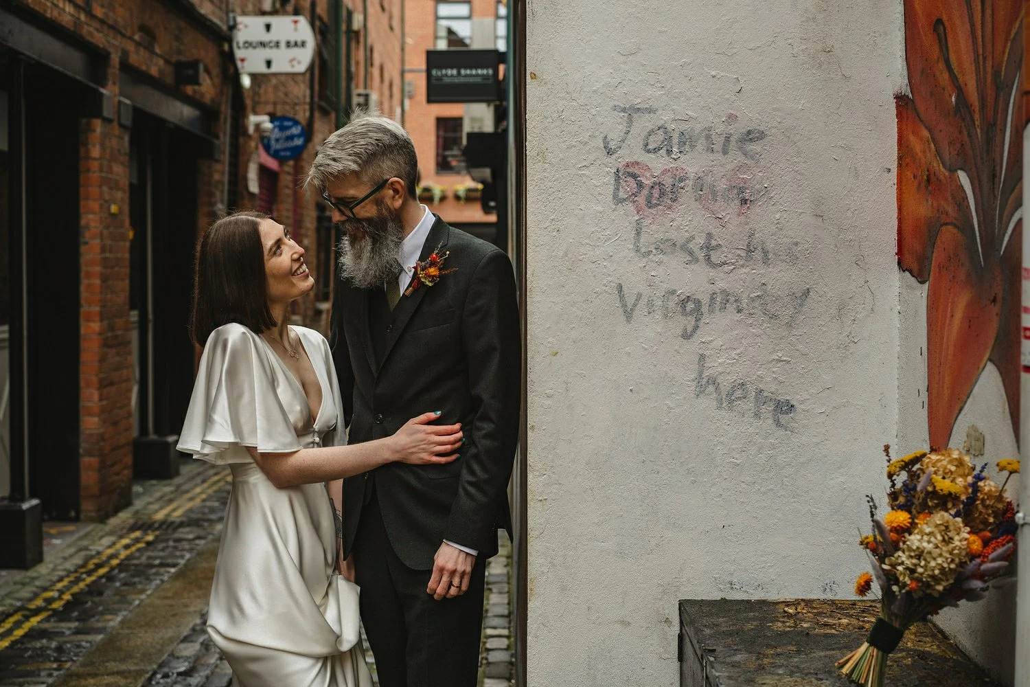  Kathryn and ChrisÕs wedding was supposed to be in Babel rooftop but it burned down 4 days before they were due to get married.  Instead they had their humanist wedding in their own house followed by photos in nearby Ormeau Park and Belfast Cathedral