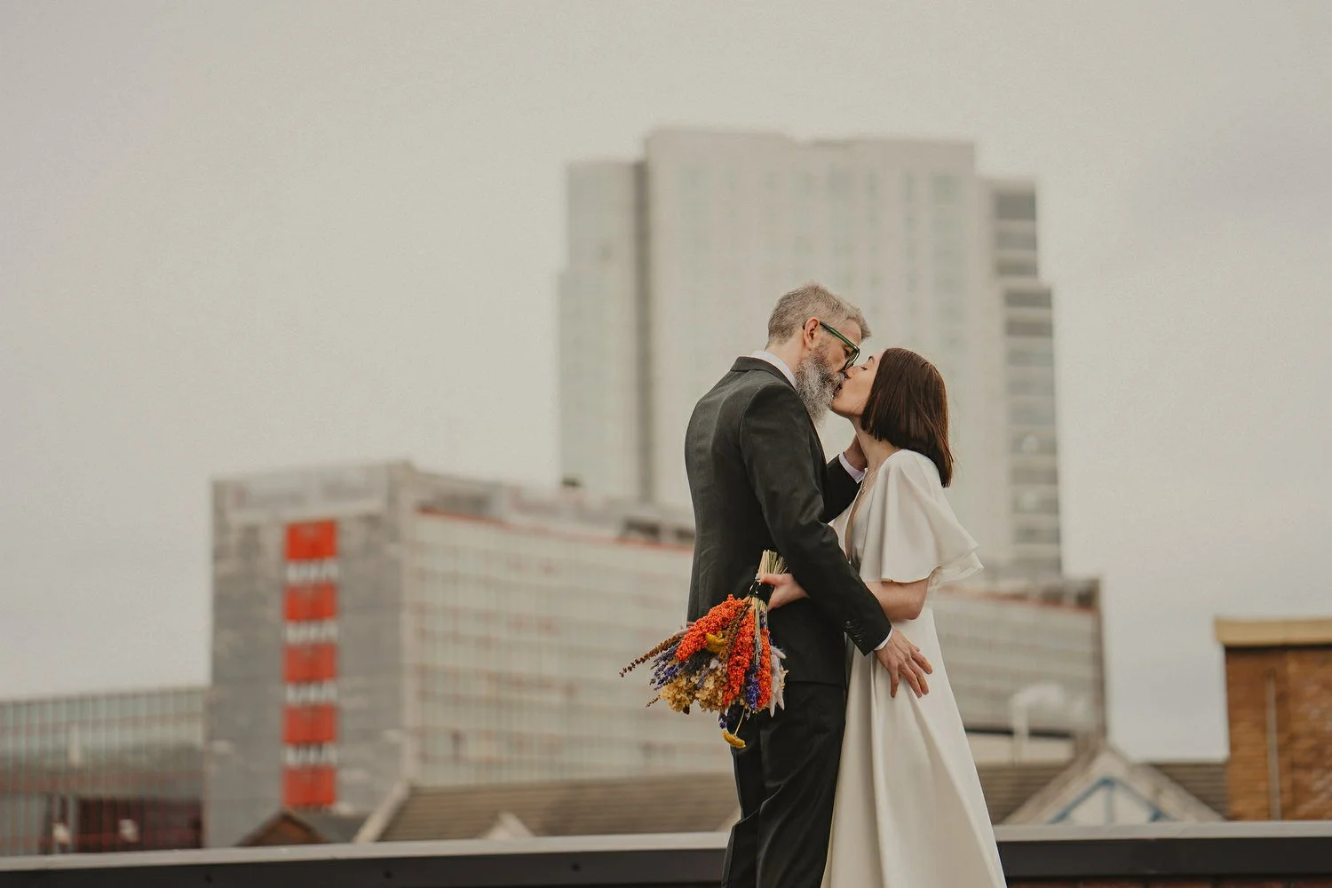  Kathryn and ChrisÕs wedding was supposed to be in Babel rooftop but it burned down 4 days before they were due to get married.  Instead they had their humanist wedding in their own house followed by photos in nearby Ormeau Park and Belfast Cathedral