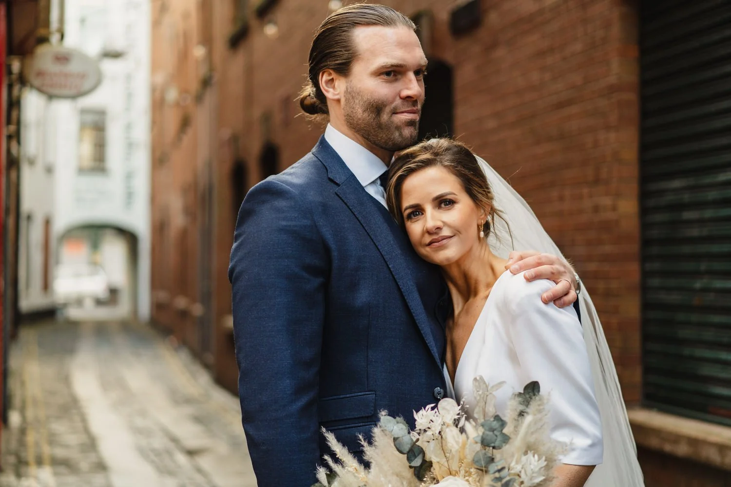  Laura and Matthews wedding in the Muddler’s Club restaurant in Belfast’s Cathedral Quarter. The couple got ready in the Hilton hotel before heading to St.Malachy’s church for their ceremony. Afterwards, we took photos around Cathedral Quarter before