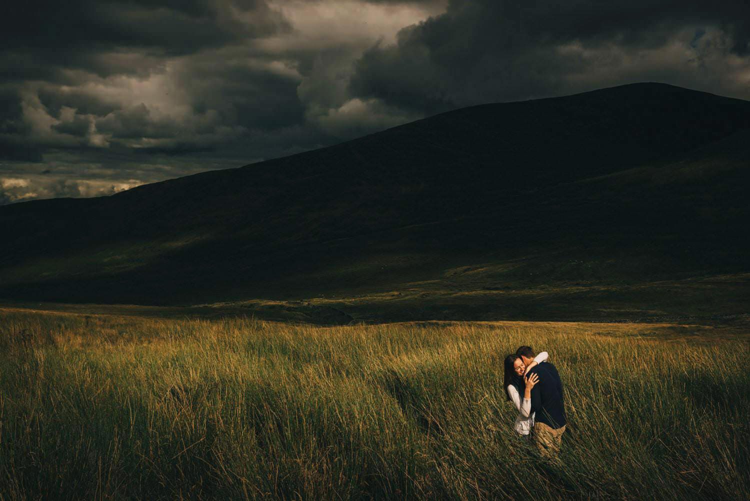 An engagement shoot in the mourne mountains in northern Ireland with stormy skies