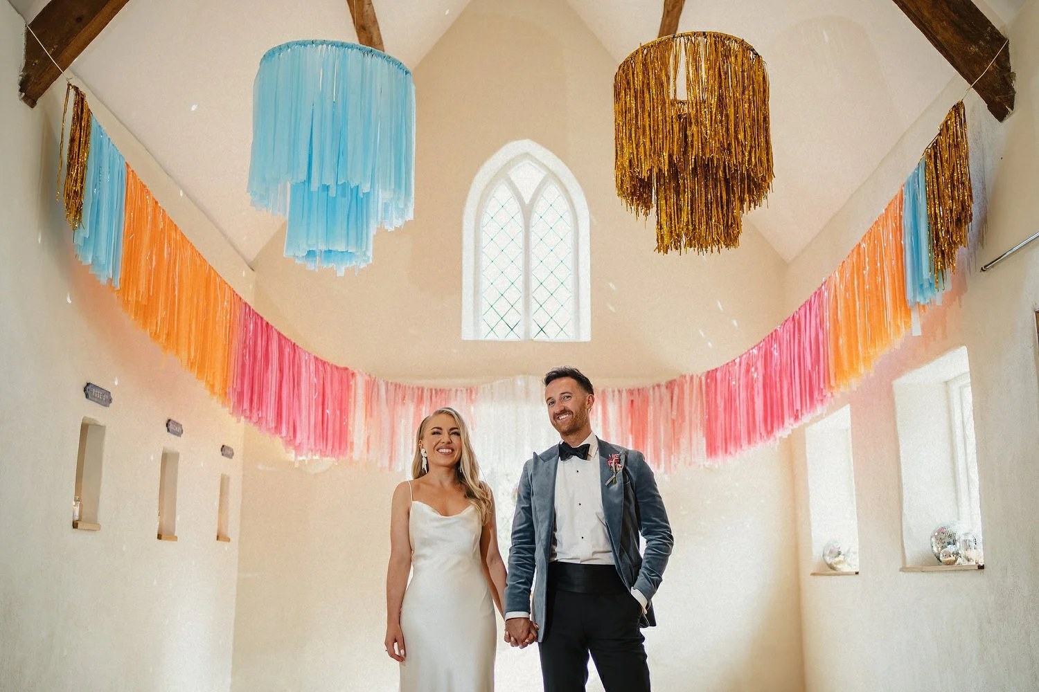 A bride and groom photographed at their wedding in Old Court Chapel in Strangford, Northern Ireland.