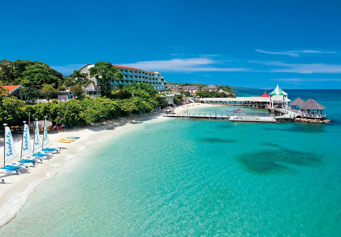 The brand new Sandals Grande Riviera – superior to other Ocho Rios resorts – has three distinctive experiences. It's a hip beach club with a chic vibe, day or night. A seaside garden paradise with babbling brooks and extraordinary ocean views. An exclusive All-Butler Village with a plantation-style Great House perched atop a mountain, where cool drinks are served with warm hospitality. A true Garden of Eden encompassing over 100 acres, this resort is so vast and lush that, no matter where you find yourself, you'll always feel as if there's plenty of space for just the two of you. All the things that make Jamaica such a uniquely spectacular destination are at the heart of Sandals Grande Riviera. Jamaica's most dramatic luxury all-inclusive resort has truly arrived.