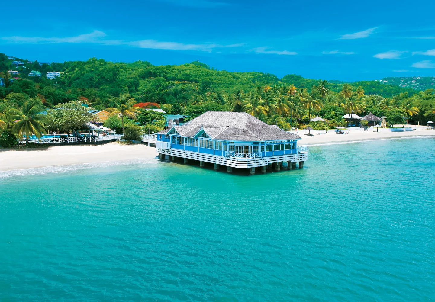 If ever there was a resort that embraces the quintessential Caribbean, Sandals Halcyon Beach is surely it. Here in the midst of a tropical utopia, where majestic palms line a pristine beach and verdant mountains rise from a turquoise sea, you'll discover a charming and intimate sanctuary that's the essence of its name...tranquil, peaceful and calm. This is a true Garden of Eden, a place where your senses are elevated into overdrive by caressing sea breezes, inviting ocean waters, and fragrant tropical blooms. Experience pampering with an exemplary level of refined service, and surrender to a world of enchanting temptations that immerse you in the hypnotic realm of the islands.