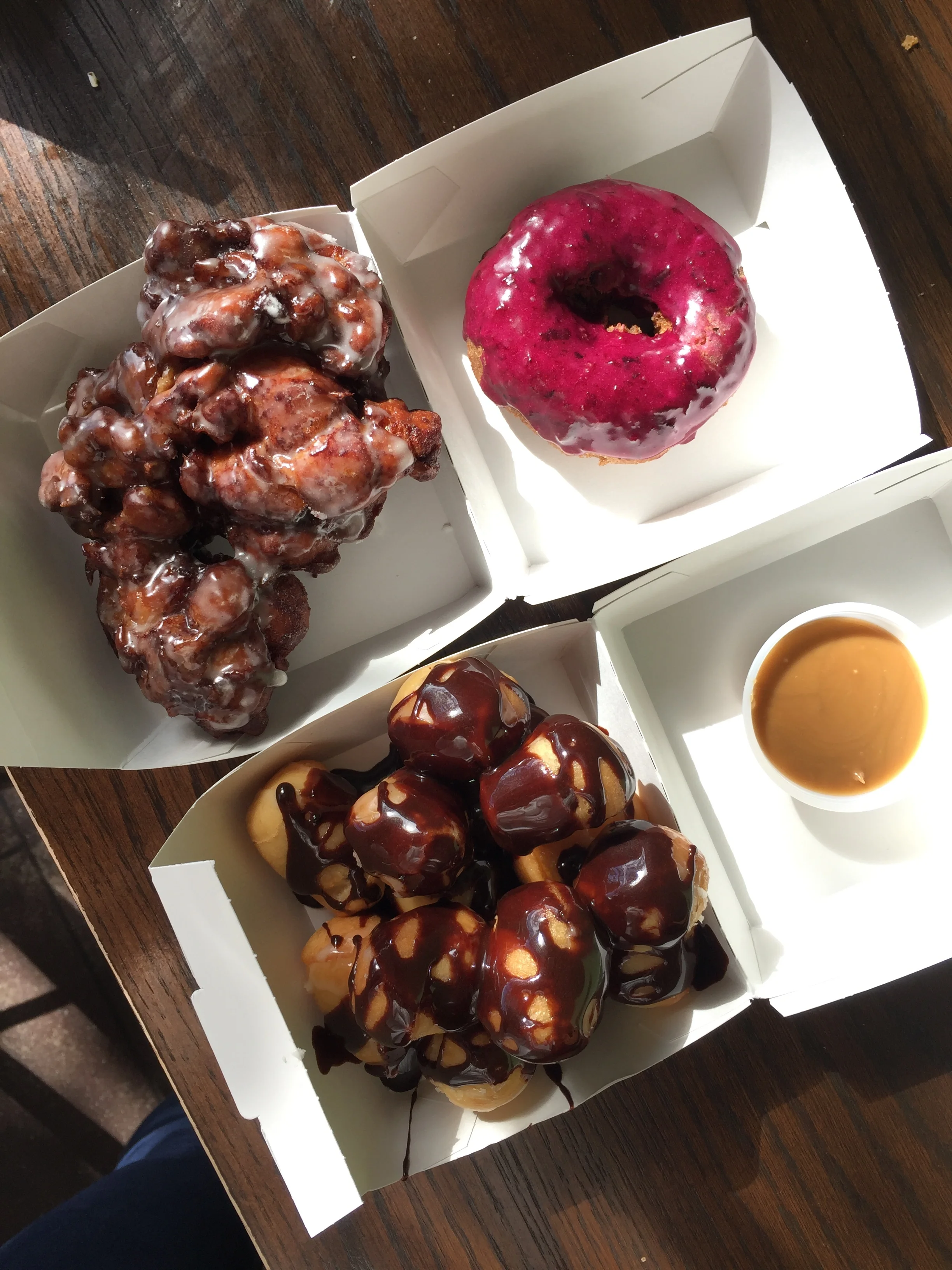 Donut Friend - apple fritter + donut holes w/ chocolate drizzle & caramel sauce + blueberry classic donut.