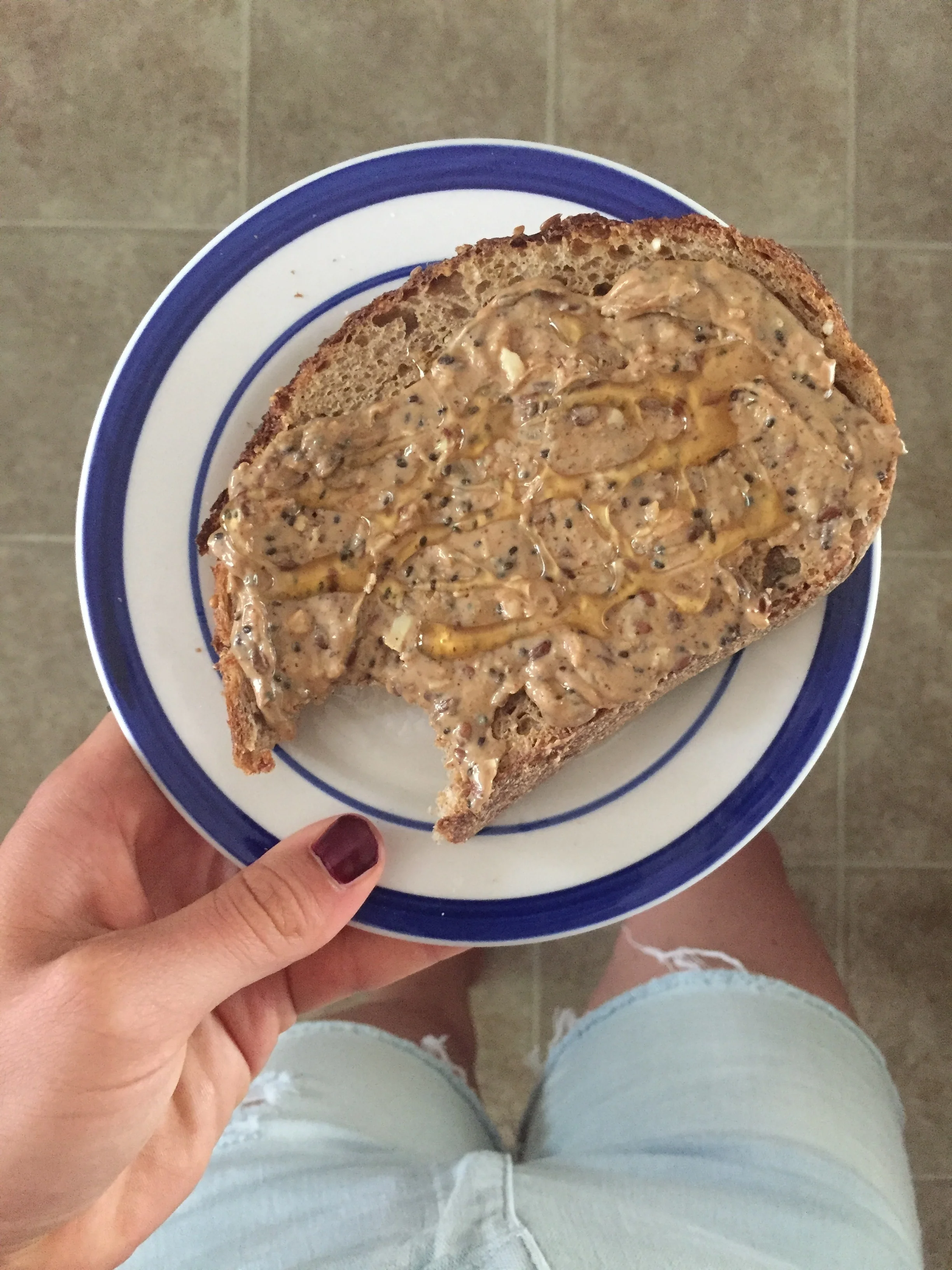 Hearty Grains bread from Breaking Bread SLO topped w/ NuttZo Peanut Pro crunchy + honey. 