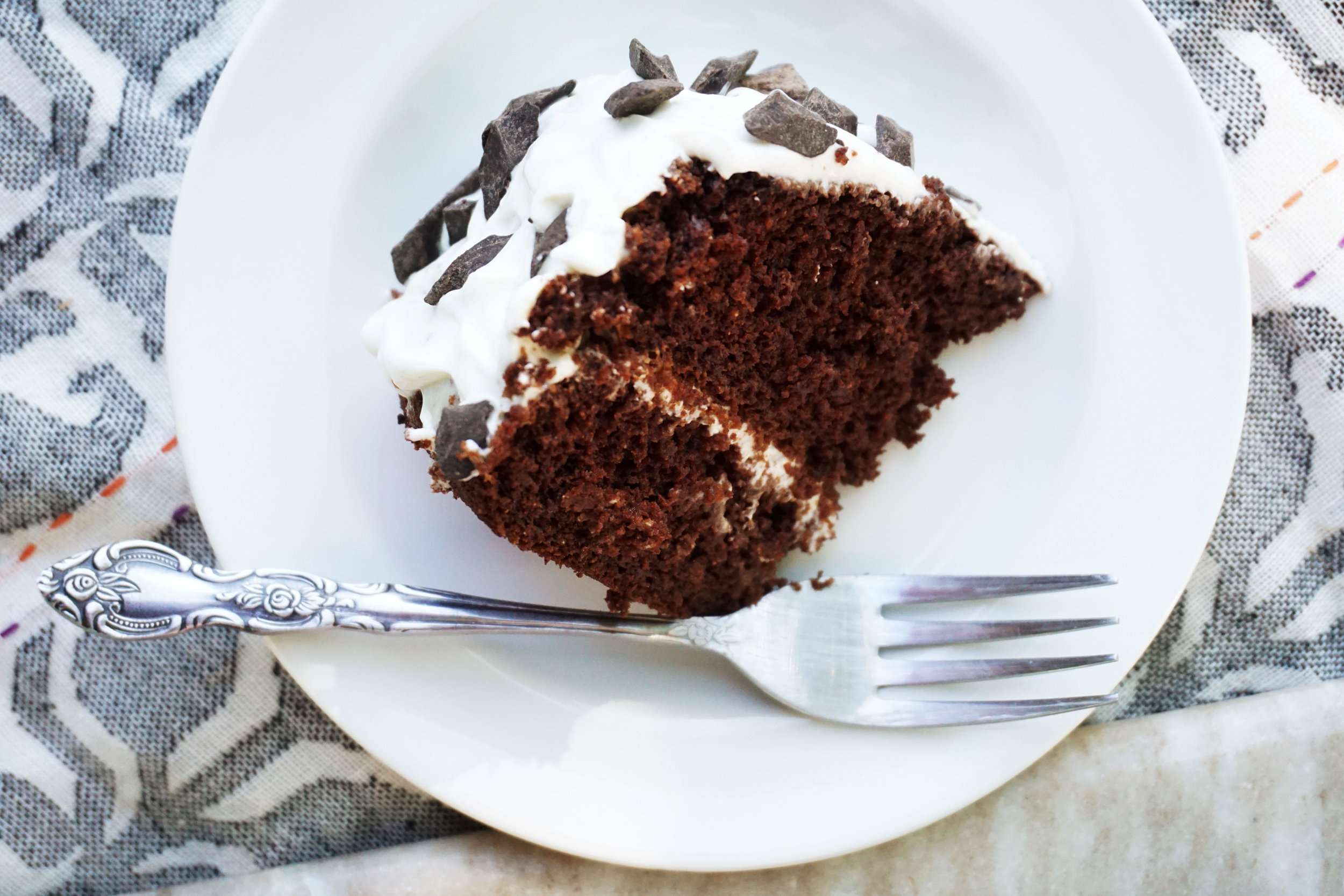 Chocolate-Studded Chocolate Cake w/ Vanilla Yogurt Frosting