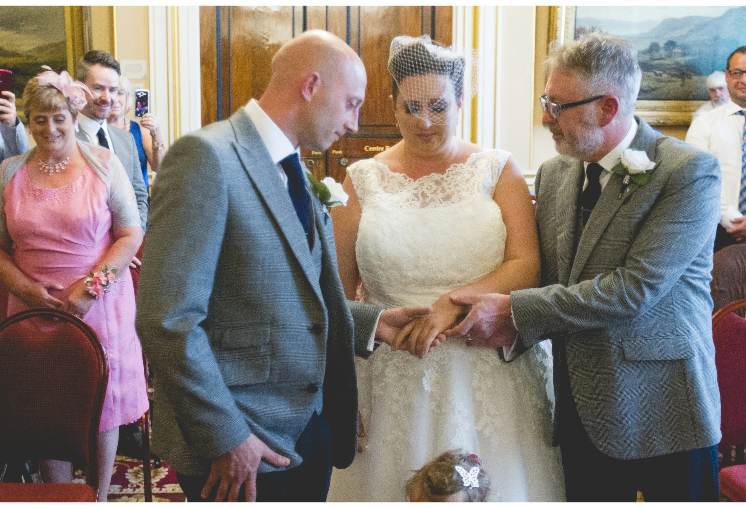 Father giving bride away 