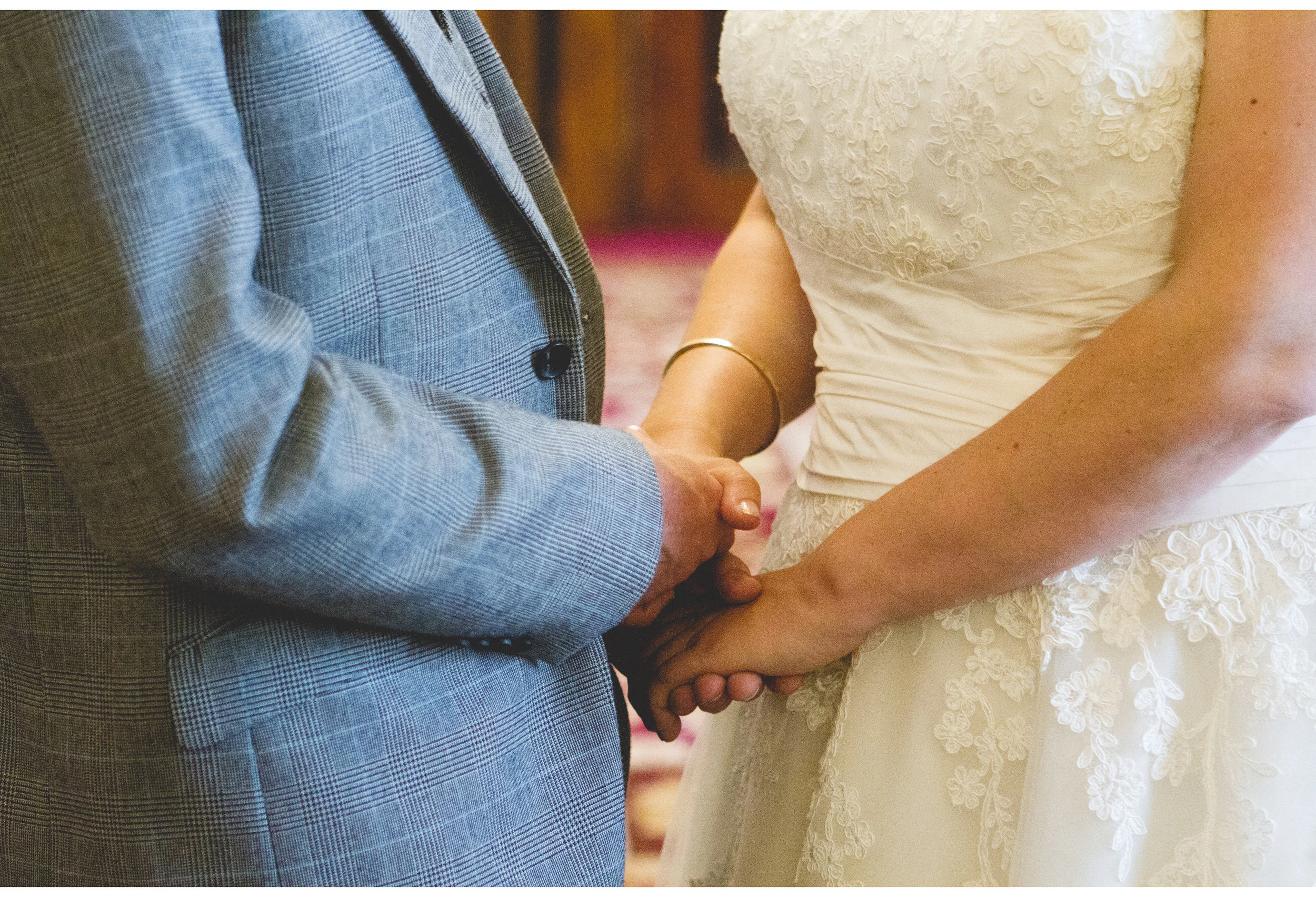 bride and groom holding hands 