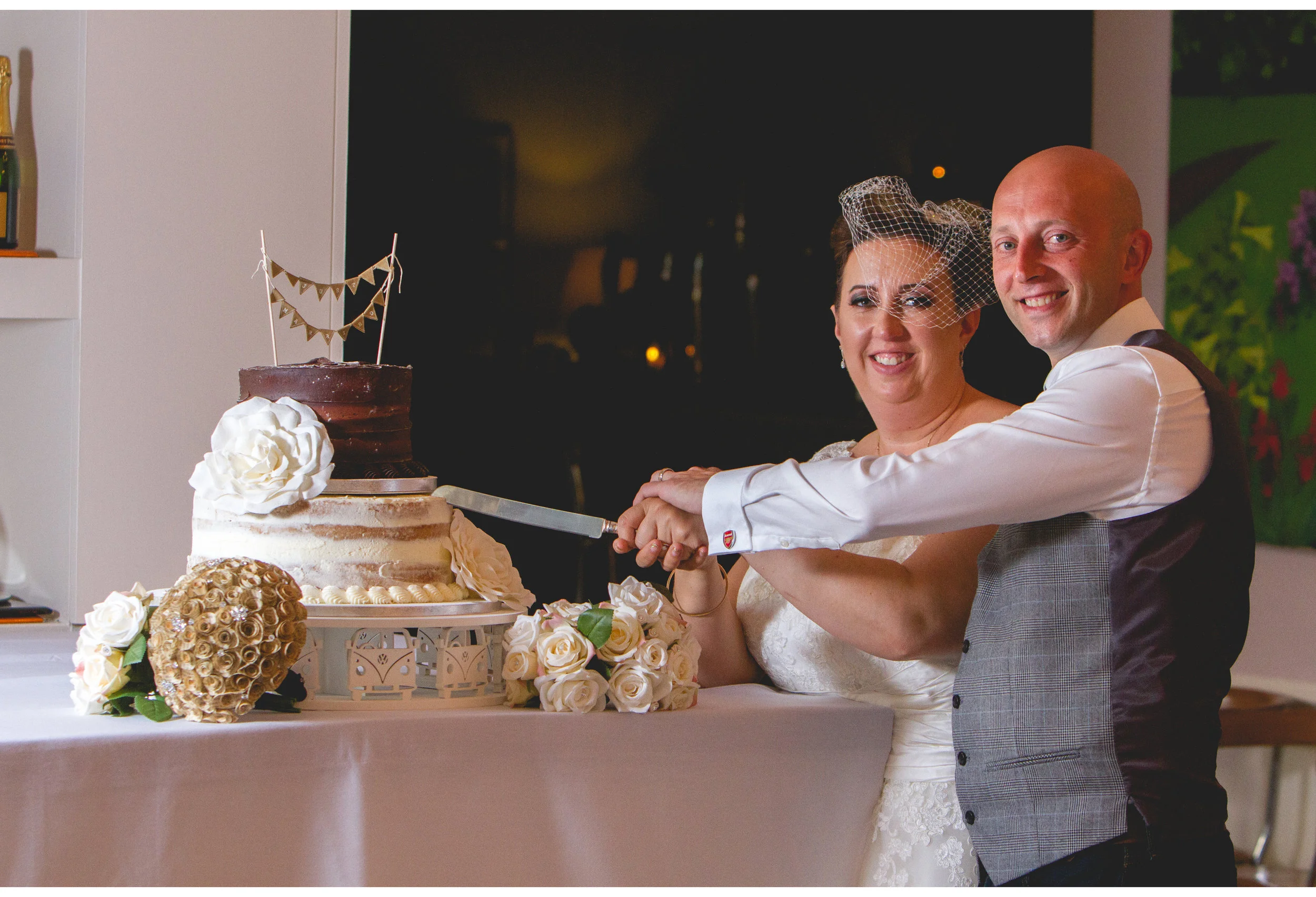 cutting the cake wedding photograph