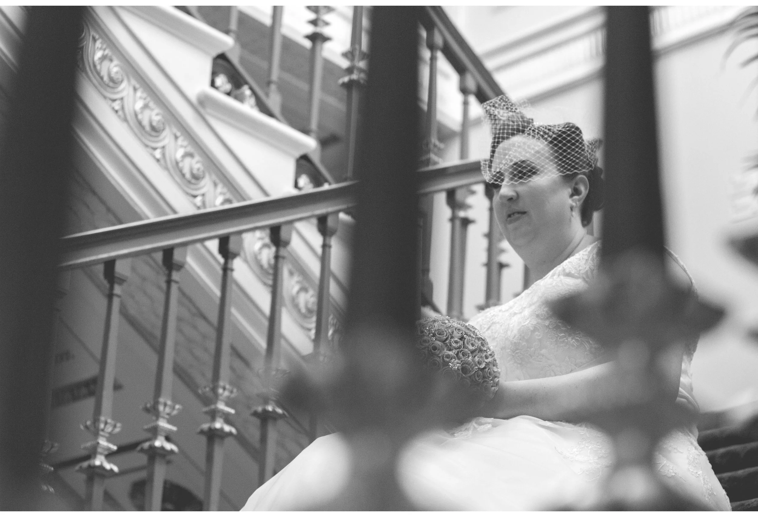 bride waiting on stairs in town hall