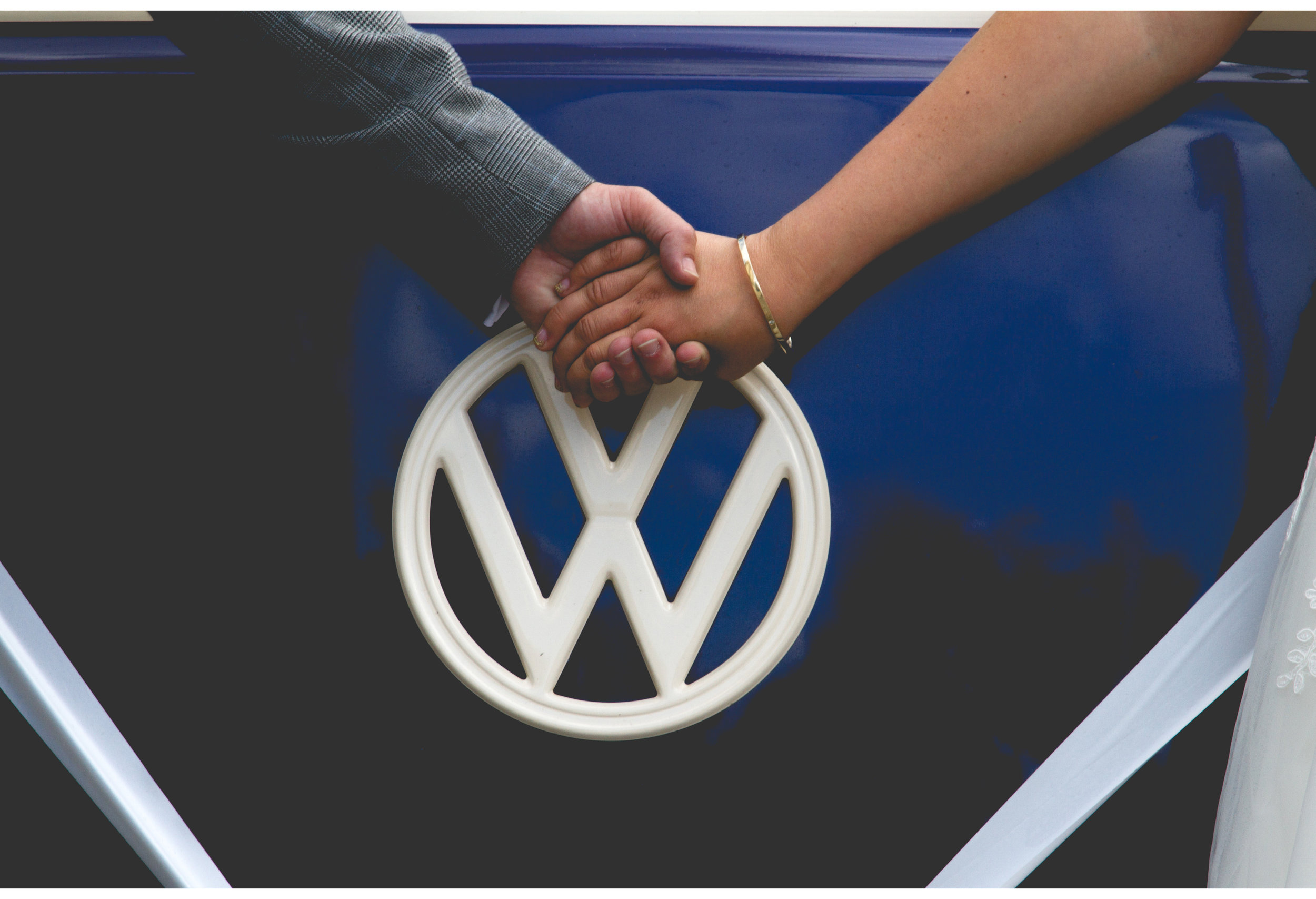 wedding couple holding hands vw bus