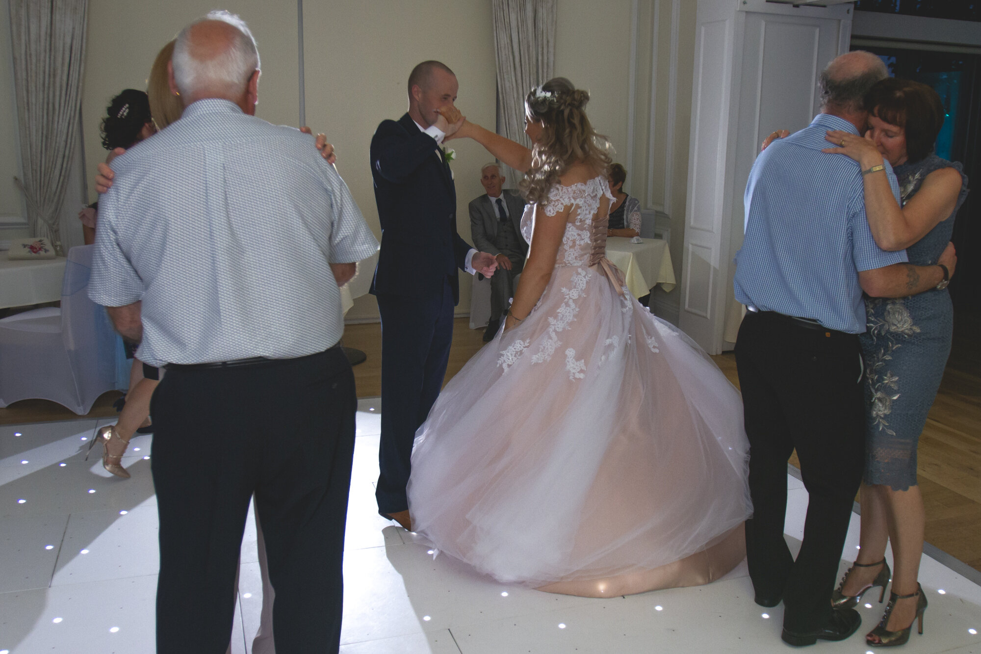 bride and groom dance with guests at Ormskirk's West Tower