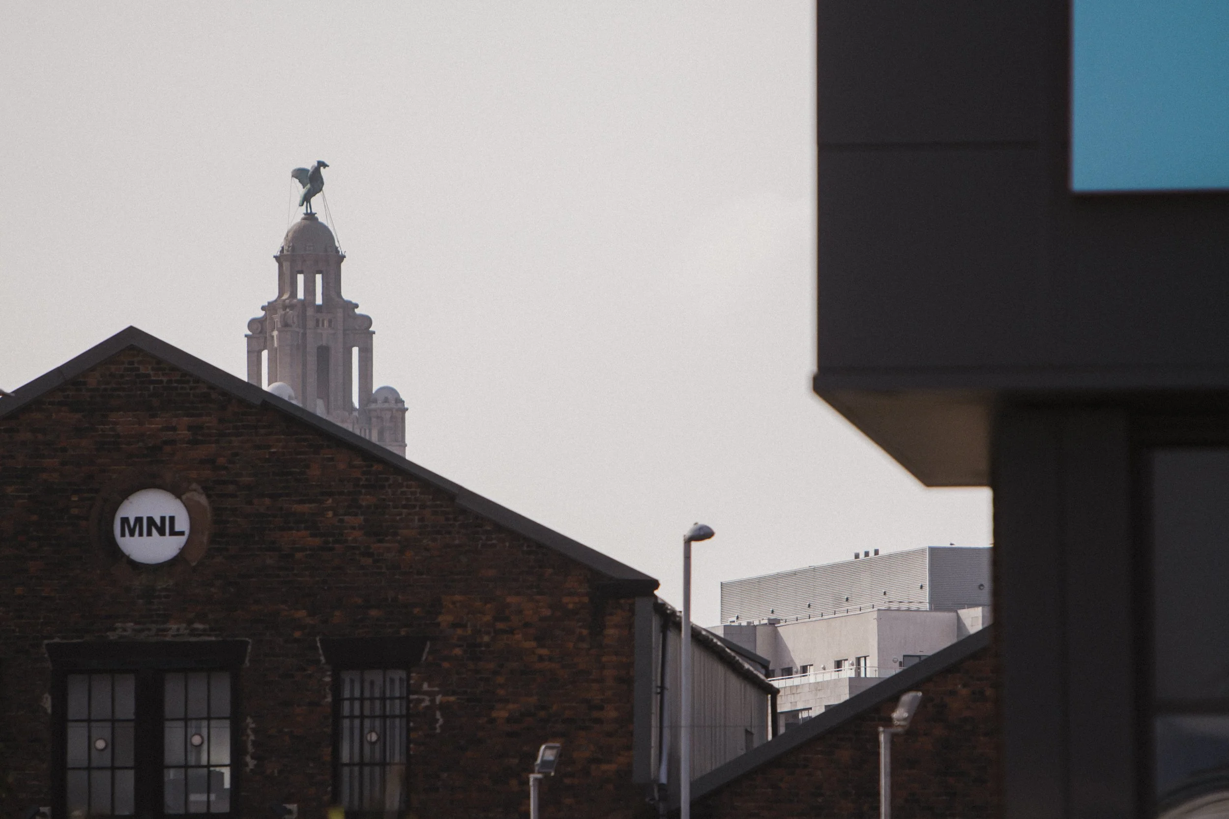  Iconic Silhouette: Liver Building Overlooks the Industrial Buildings in Liverpool's Docks, with the Proud Liver Bird Perched Atop, Creating a Stunning Scene on This Early Wedding Morning at Titanic H