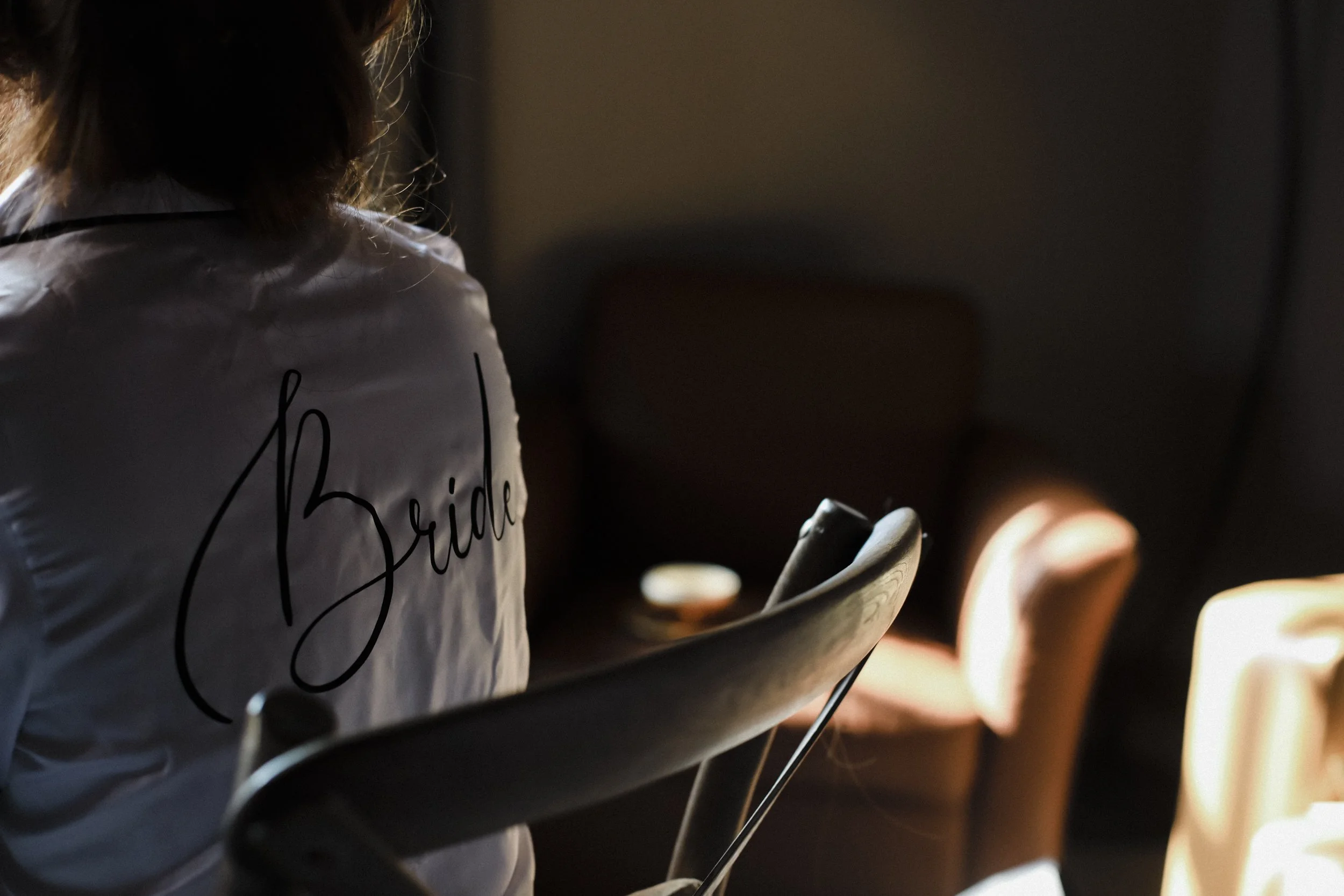 Liverpool Bride's Charm: Bridal Dressing Gown Captured at Titanic Hotel, Adding a Touch of Local Flair to the Preparations.