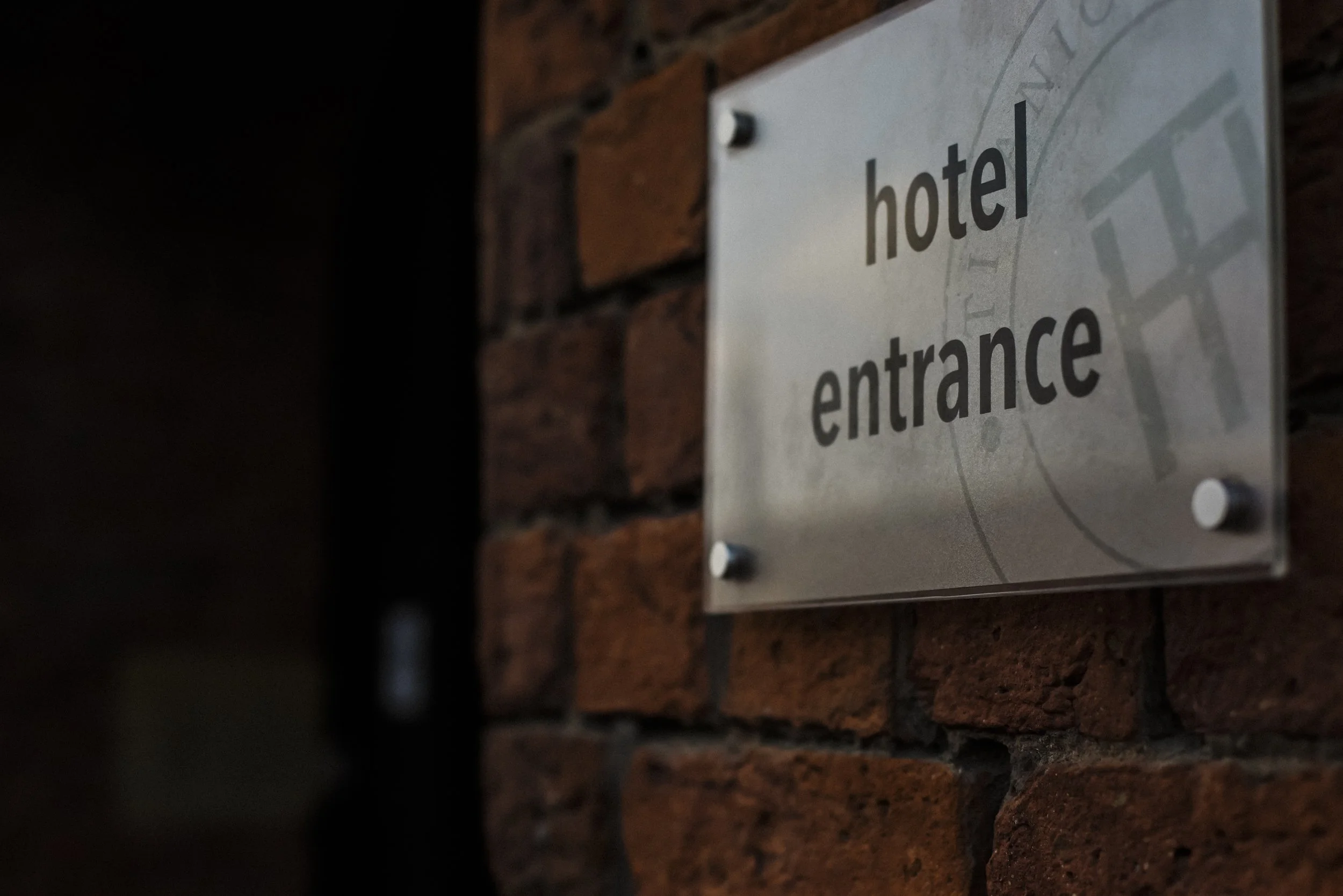 Welcome to Titanic Hotel Liverpool: Entrance Sign of Titanic Hotel Liverpool, Setting the Stage for a Titanic Wedding Celebration.