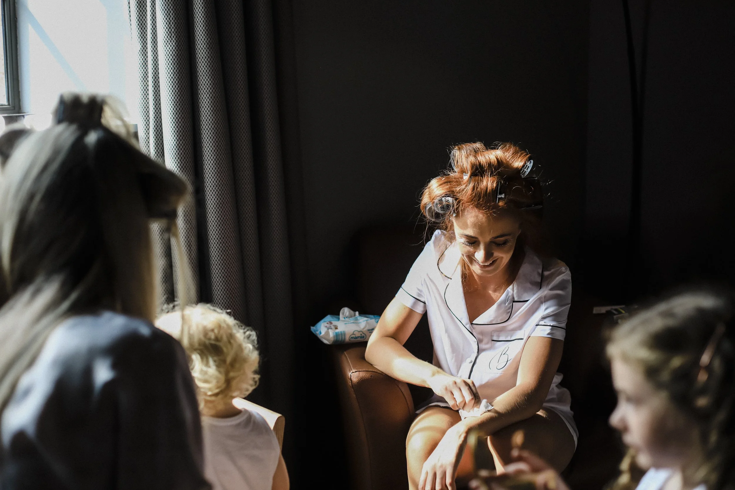 Sunlit Beauty: Bride Bathed in Sunlight from the Window at Titanic Hotel, Radiating Elegance and Grace in the Natural Glow. 